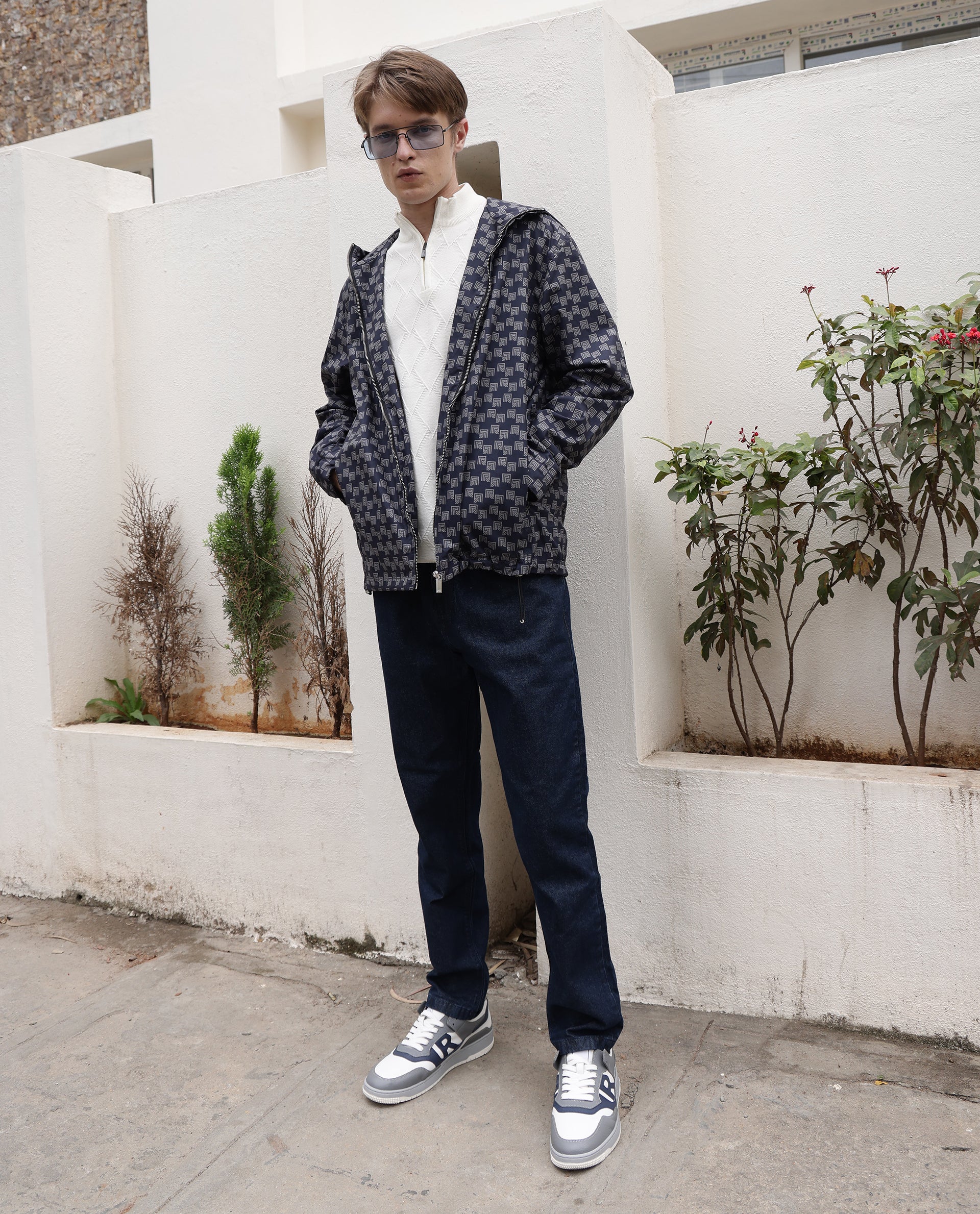 Rare Rabbit Men Gleb Dark Blue Cotton Fabric Mid Rise Carrot Fit Mid Wash Plain Denim Trousers