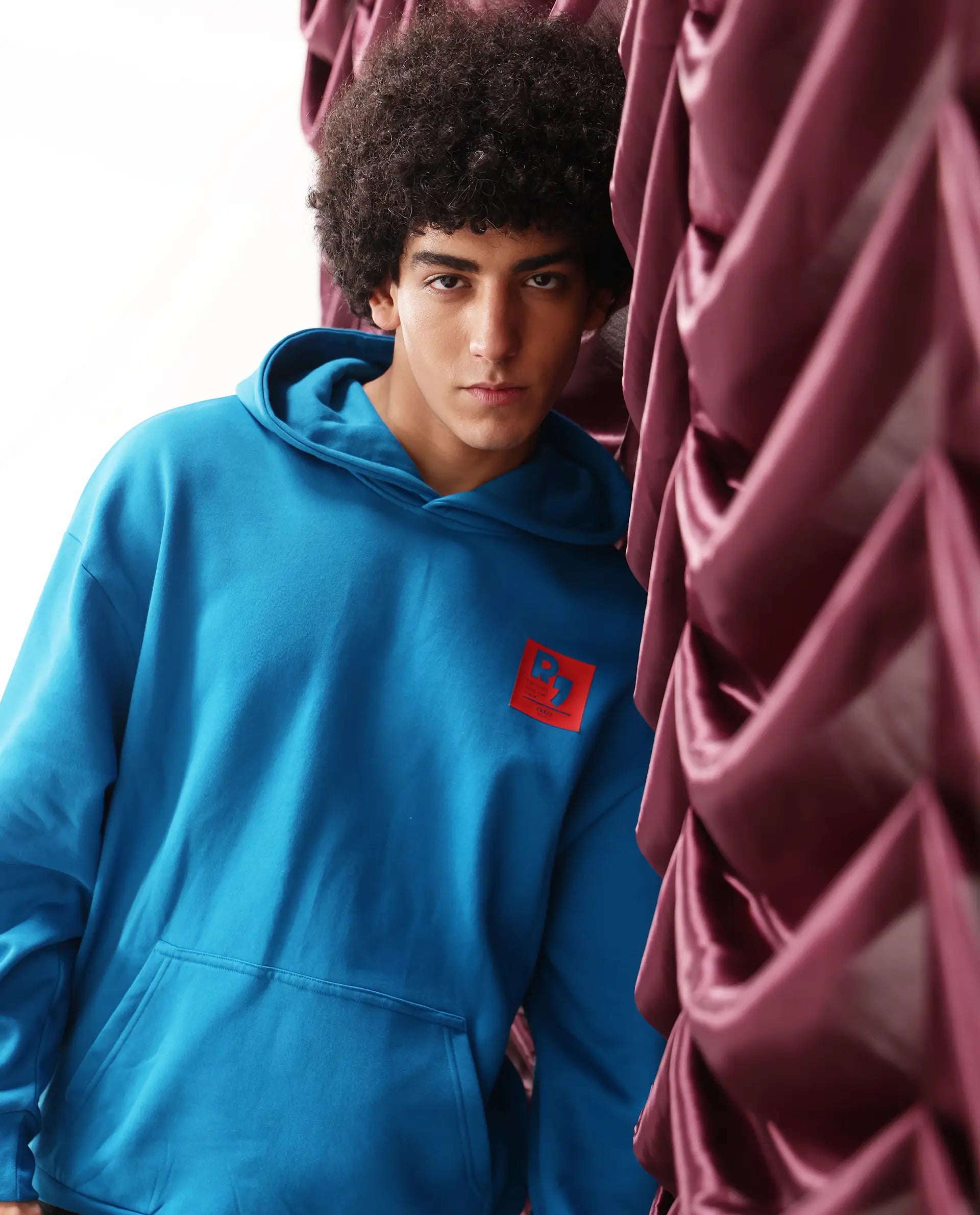 Rare Rabbit Men Dary Flouroscent Blue Cotton Polyester Fabric Full Sleeve Crew Neck Boxy Fit Puff Print Hooded Sweatshirt