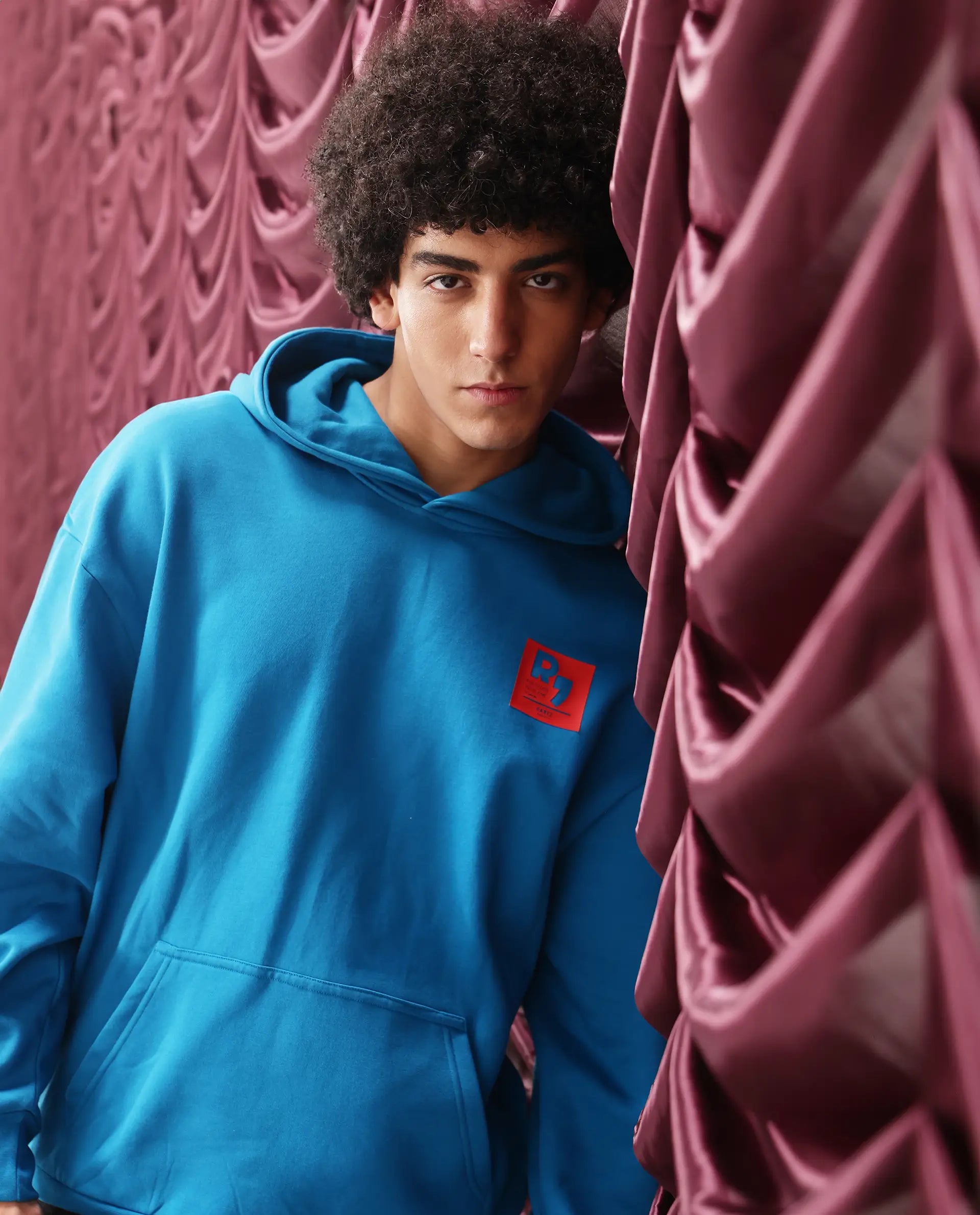 Rare Rabbit Men Dary Flouroscent Blue Cotton Polyester Fabric Full Sleeve Crew Neck Boxy Fit Puff Print Hooded Sweatshirt