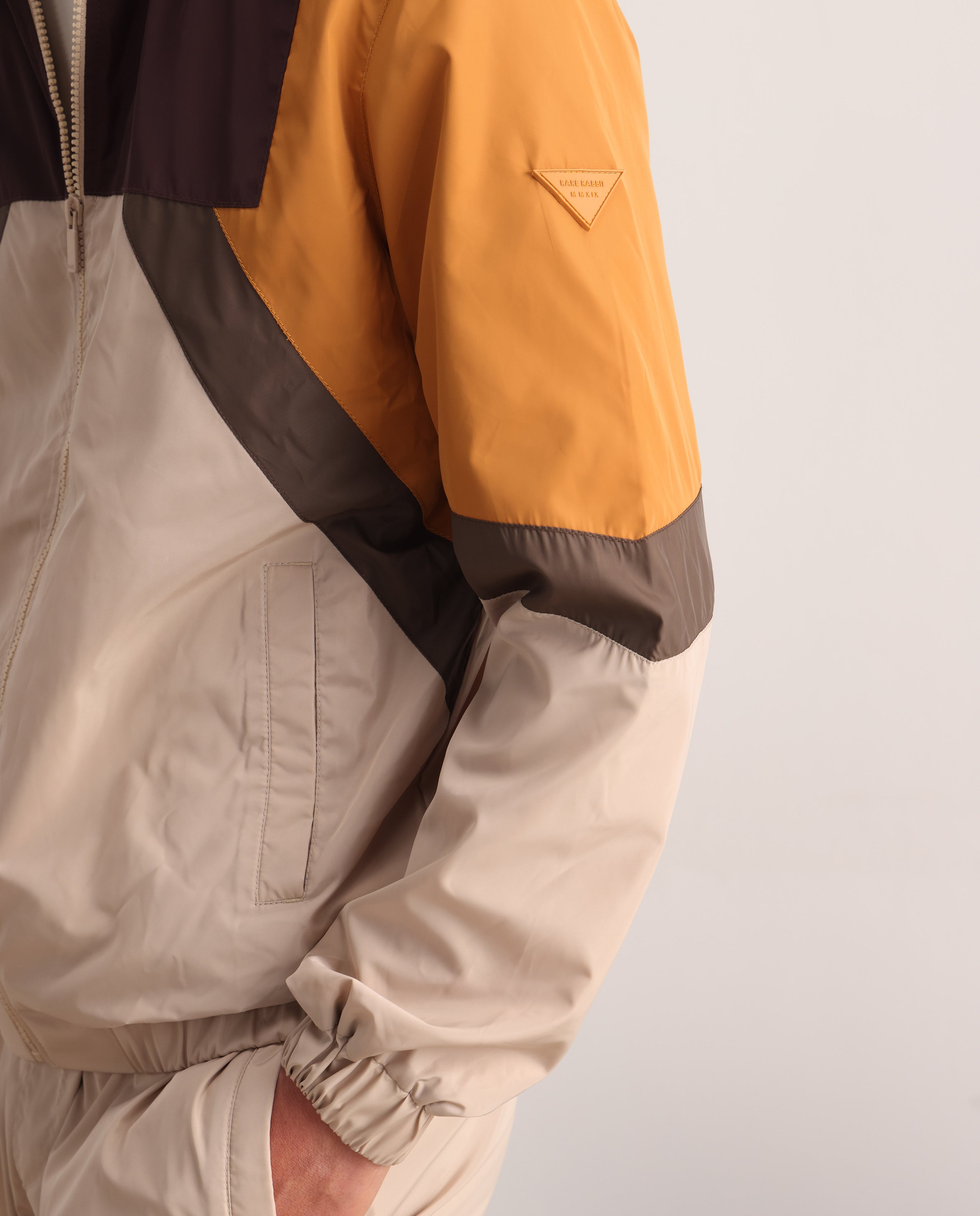 Rare Rabbit Men Malo Beige Polyester Fabric Full Sleeve High Neck Collar Zipper Closure Cut and Sew Jacket