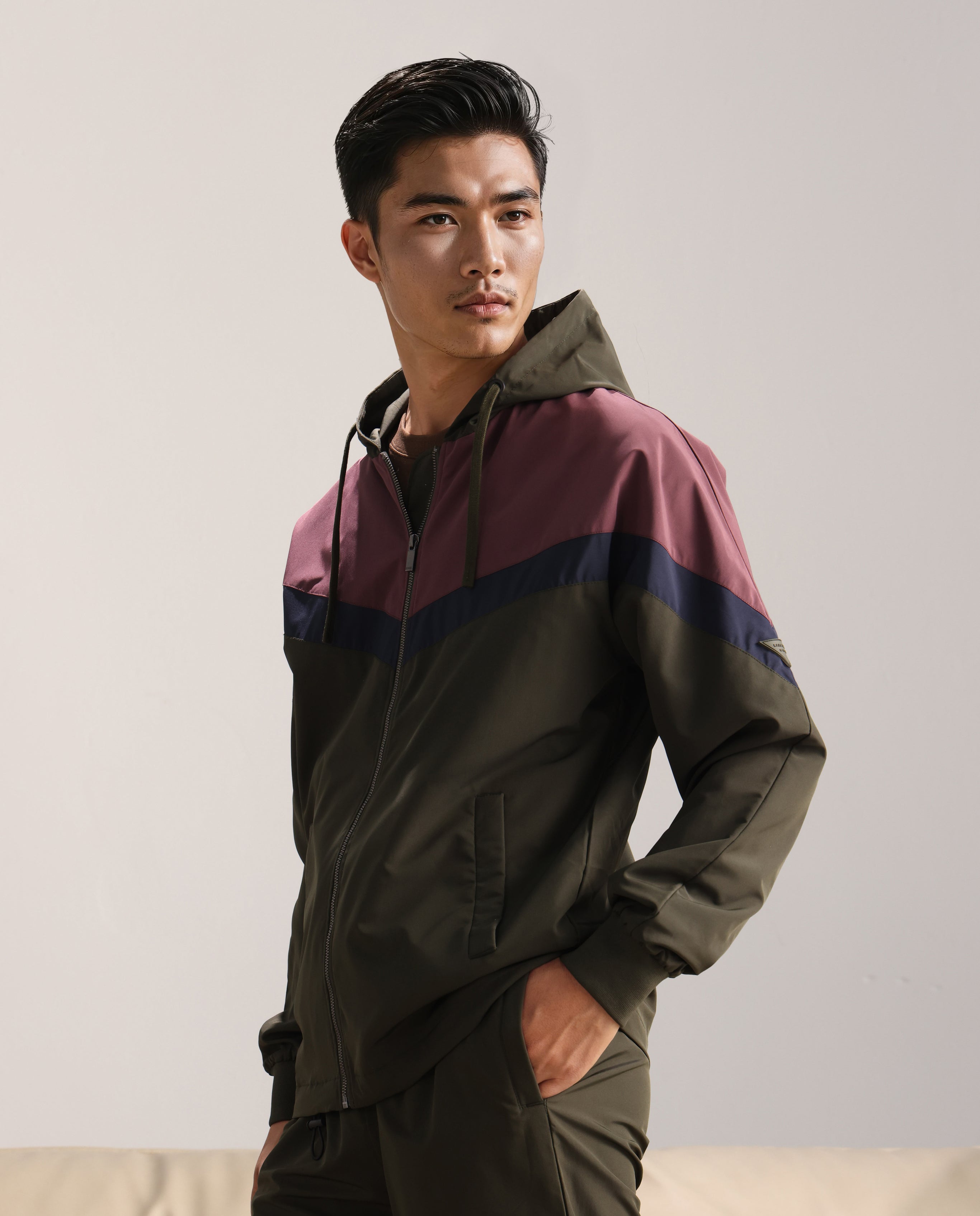 Rare Rabbit Men Waber Olive Polyester Fabric Full Sleeve Hooded Zipper Closure Cut and Sew Jacket