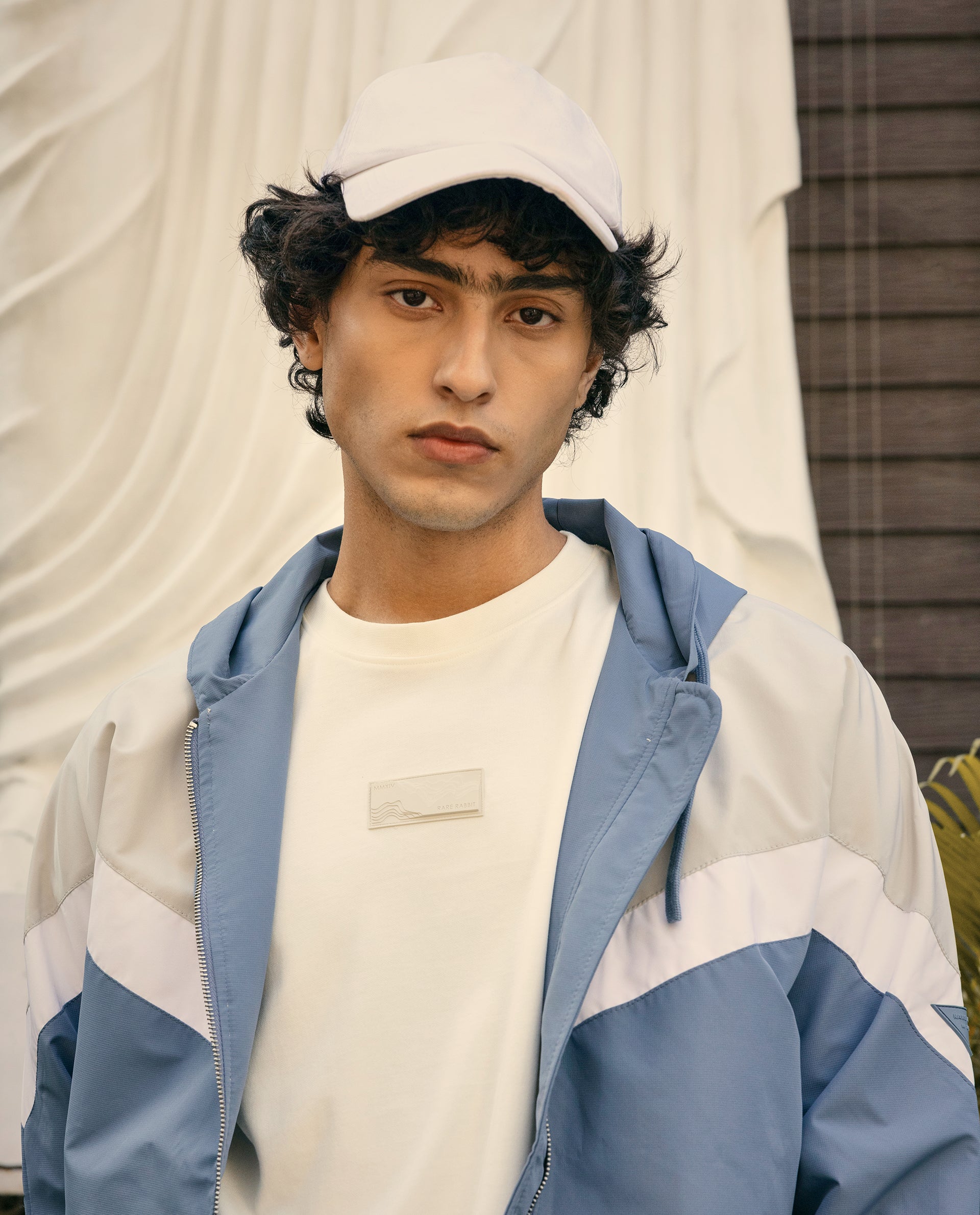 Rare Rabbit Men Waber Light Blue Polyester Fabric Full Sleeve Hooded Zipper Closure Cut and Sew Jacket