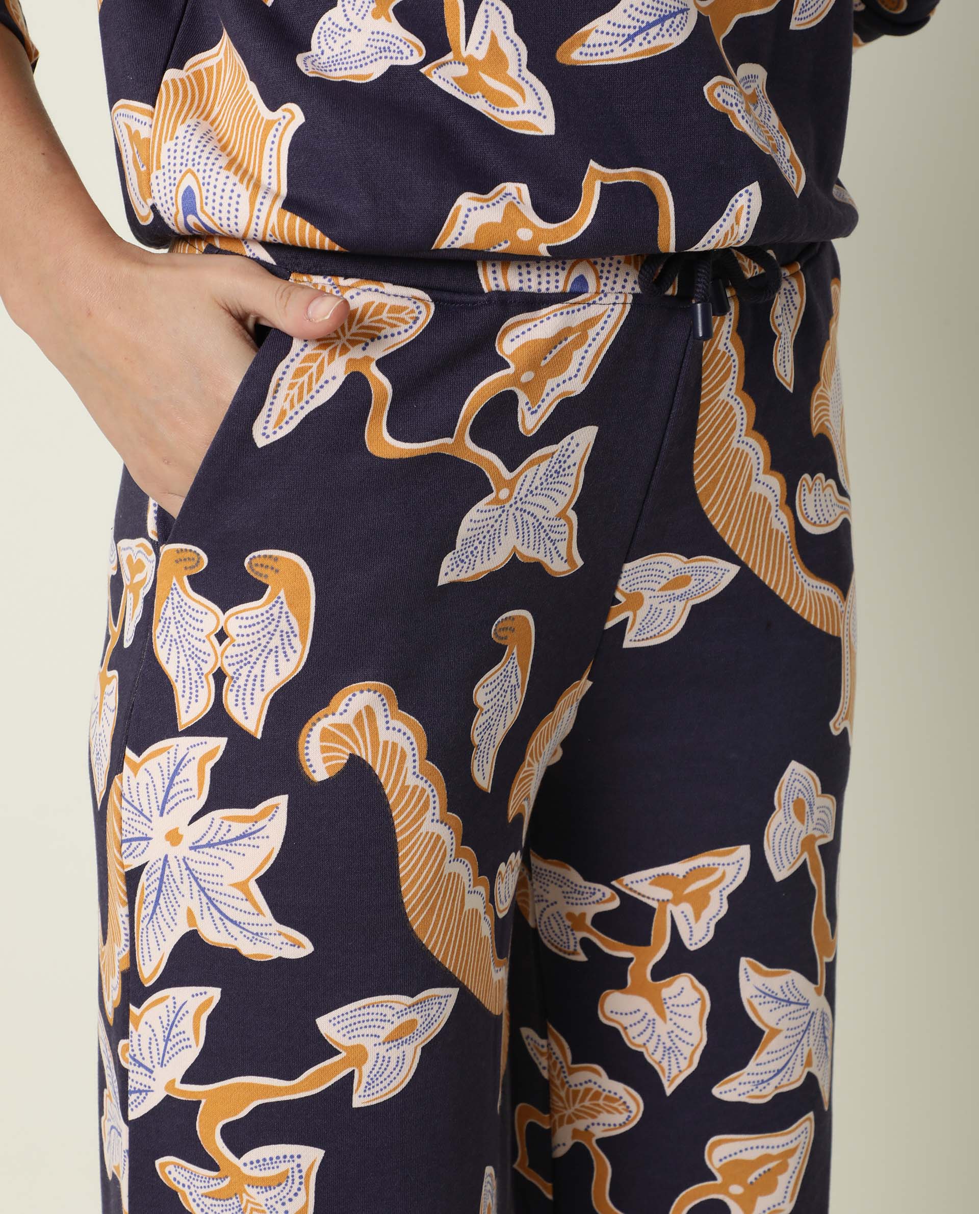 Rareism Women Bogota Navy Cotton Fabric Relaxed Fit Abstract Print Mid Rise Ankle Length Track Pant