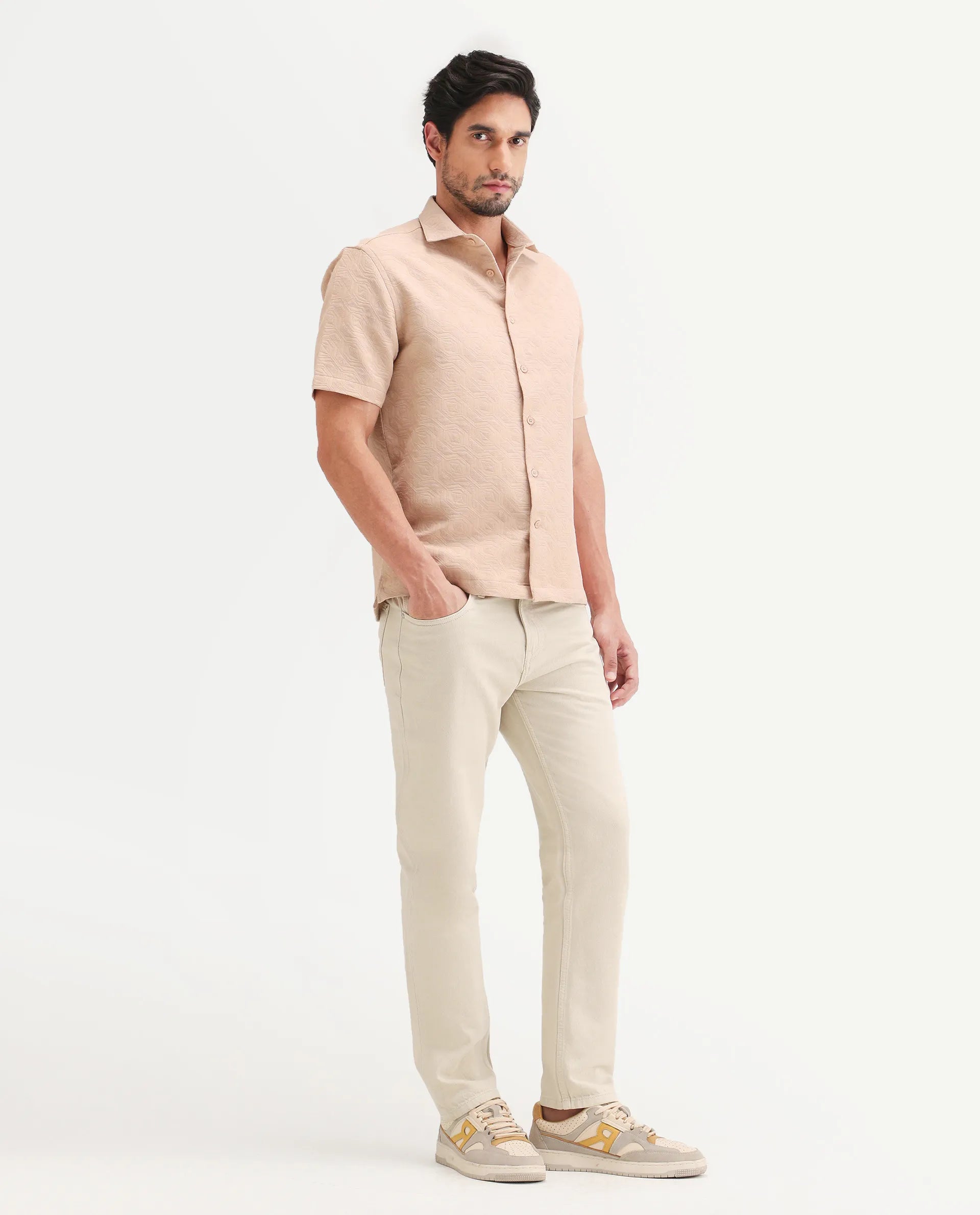 Rare Rabbit Men's Arvi B Beige Cotton Fabric Shank And Zipper Kurt Carrot Plain Jeans