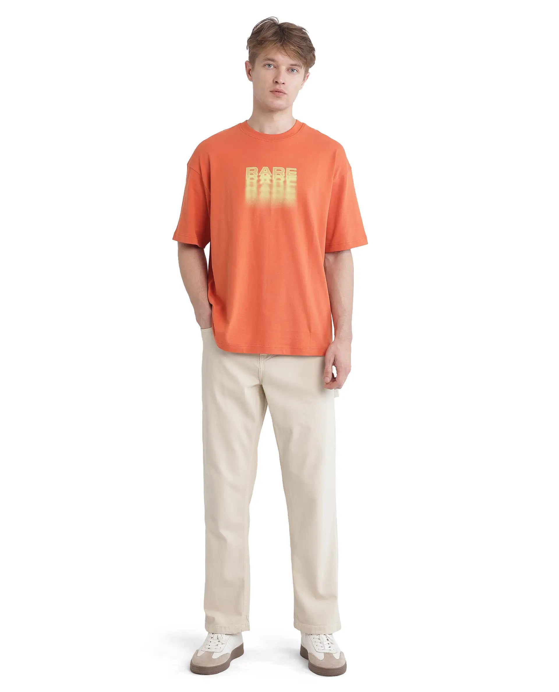 Rare Rabbit Men Act Orange Cotton Fabric Short Sleeve Crew Neck Slip-On Oversized Fit Graphic Print T-Shirt