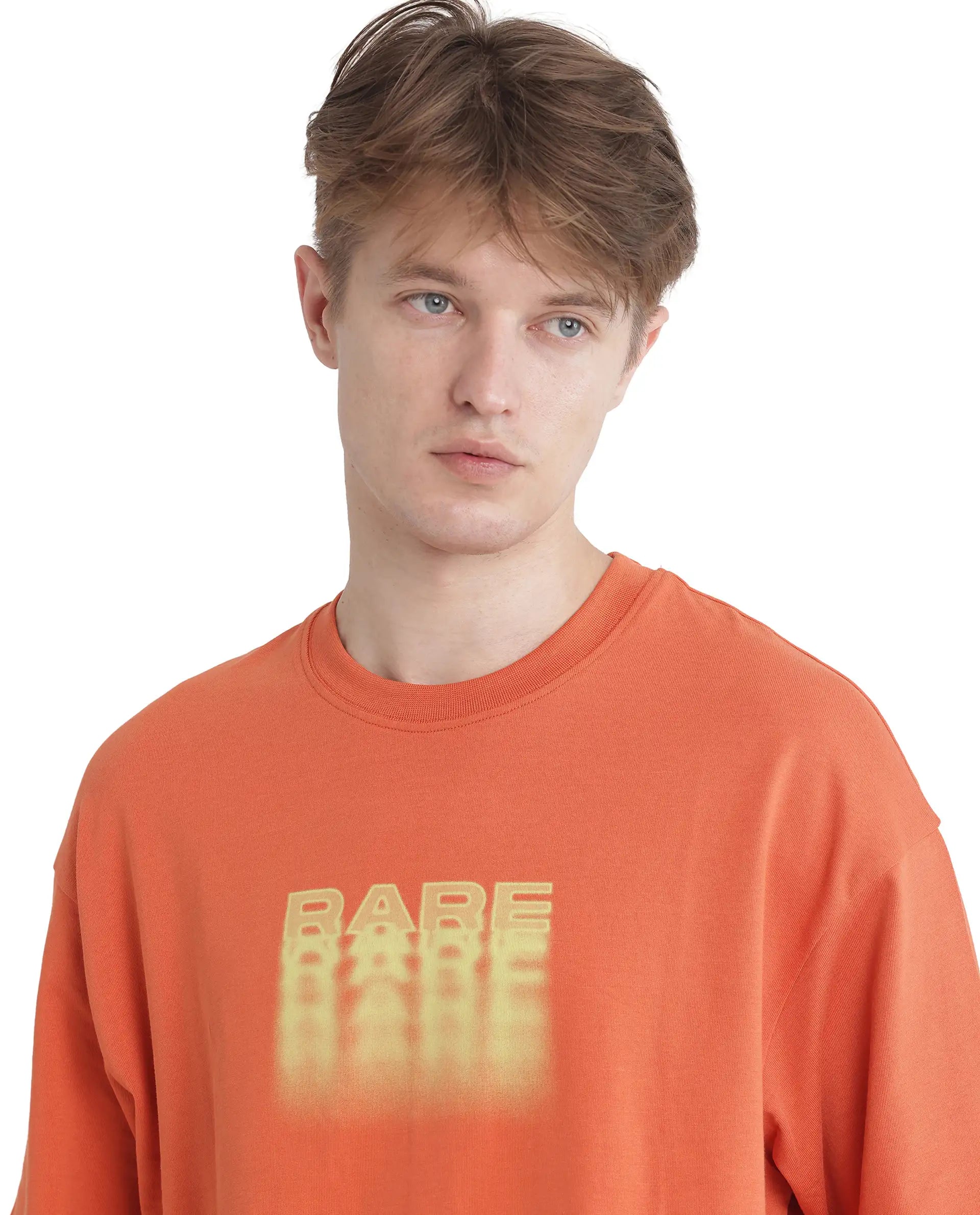 Rare Rabbit Men Act Orange Cotton Fabric Short Sleeve Crew Neck Slip-On Oversized Fit Graphic Print T-Shirt