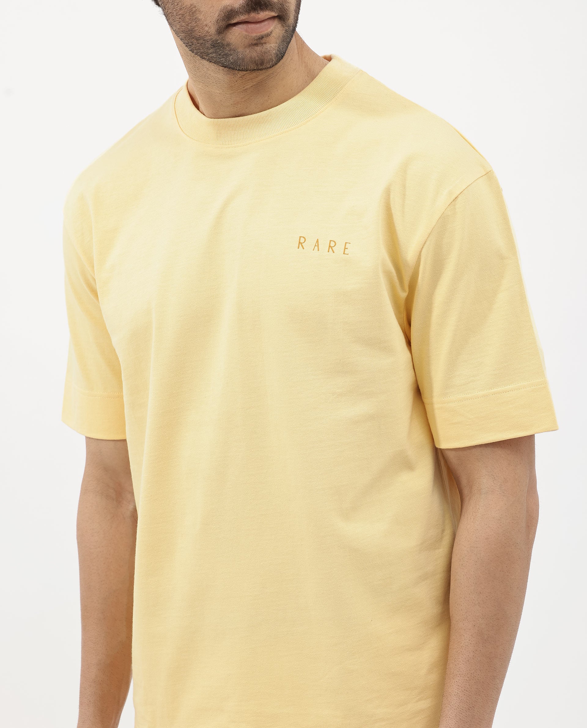 Rare Rabbit Articale Mens Beck Dusky Yellow Cotton Fabric Short Sleeve Crew Neck Oversized Fit Graphic Printed T-Shirt