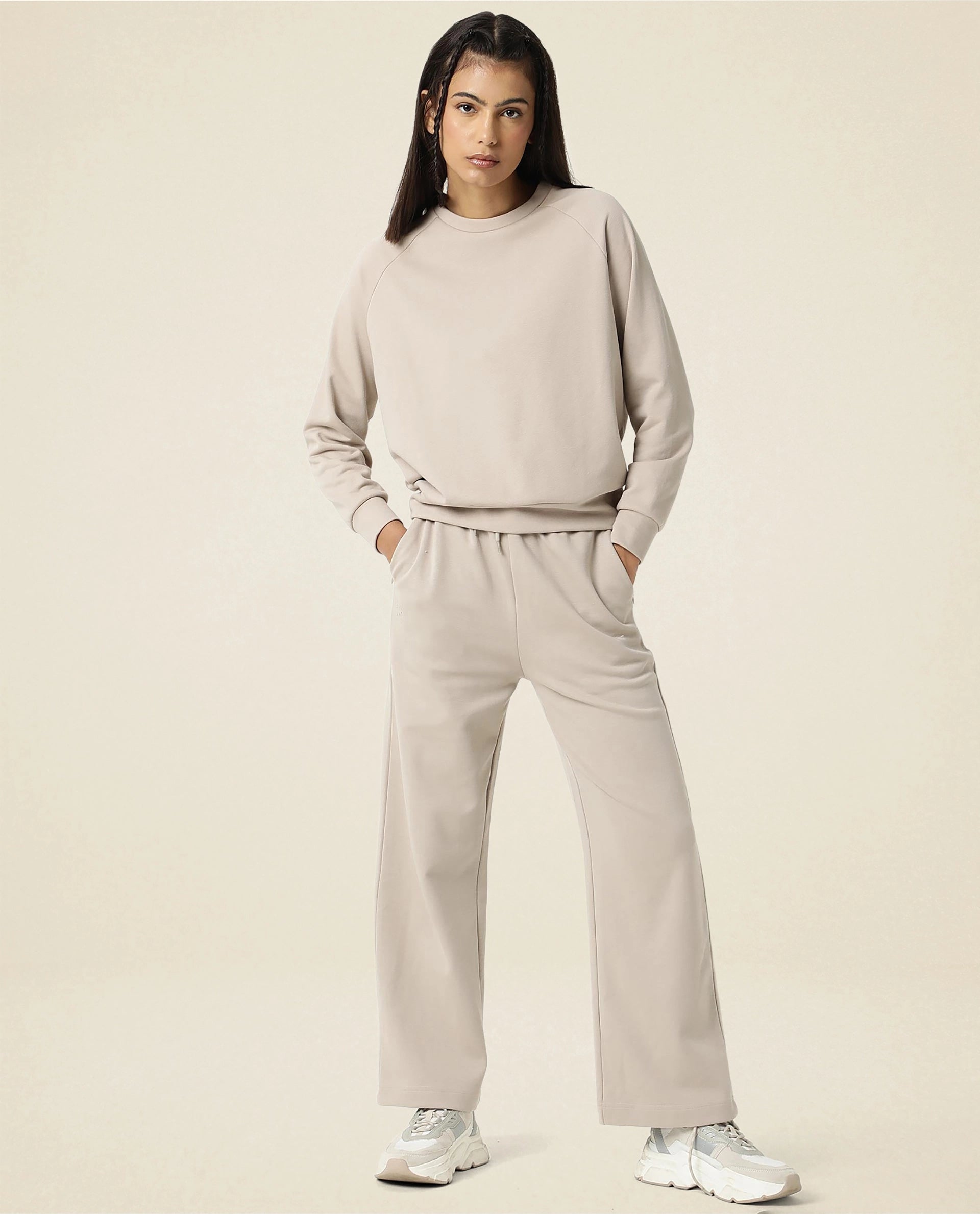 Rareism Women Capsule Beige Cotton Blend Fabric Relaxed Fit Solid Mid Rise Ankle Length Track Pant