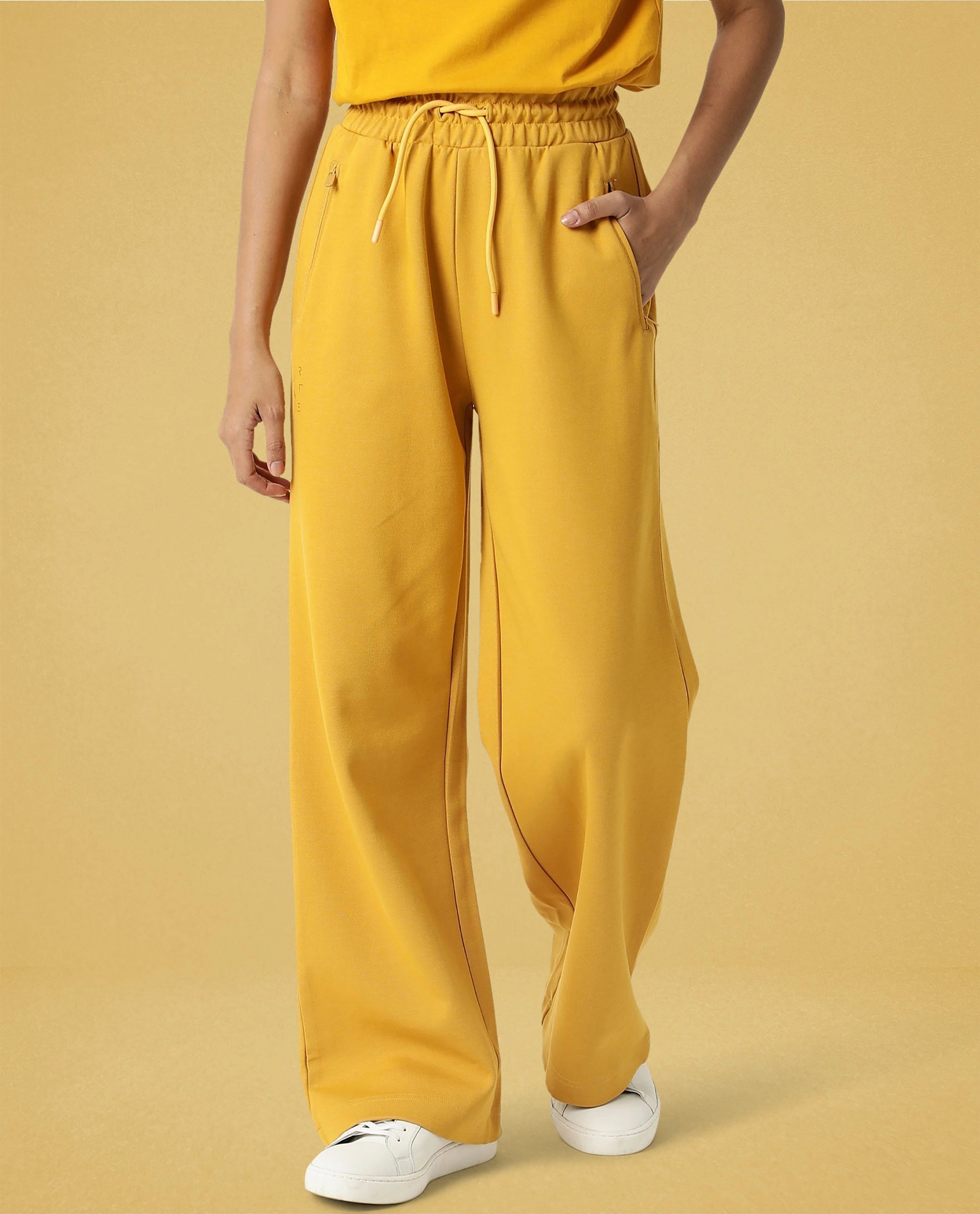 Rareism Women Capsule Mustard Cotton Blend Fabric Relaxed Fit Solid Mid Rise Ankle Length Track Pant