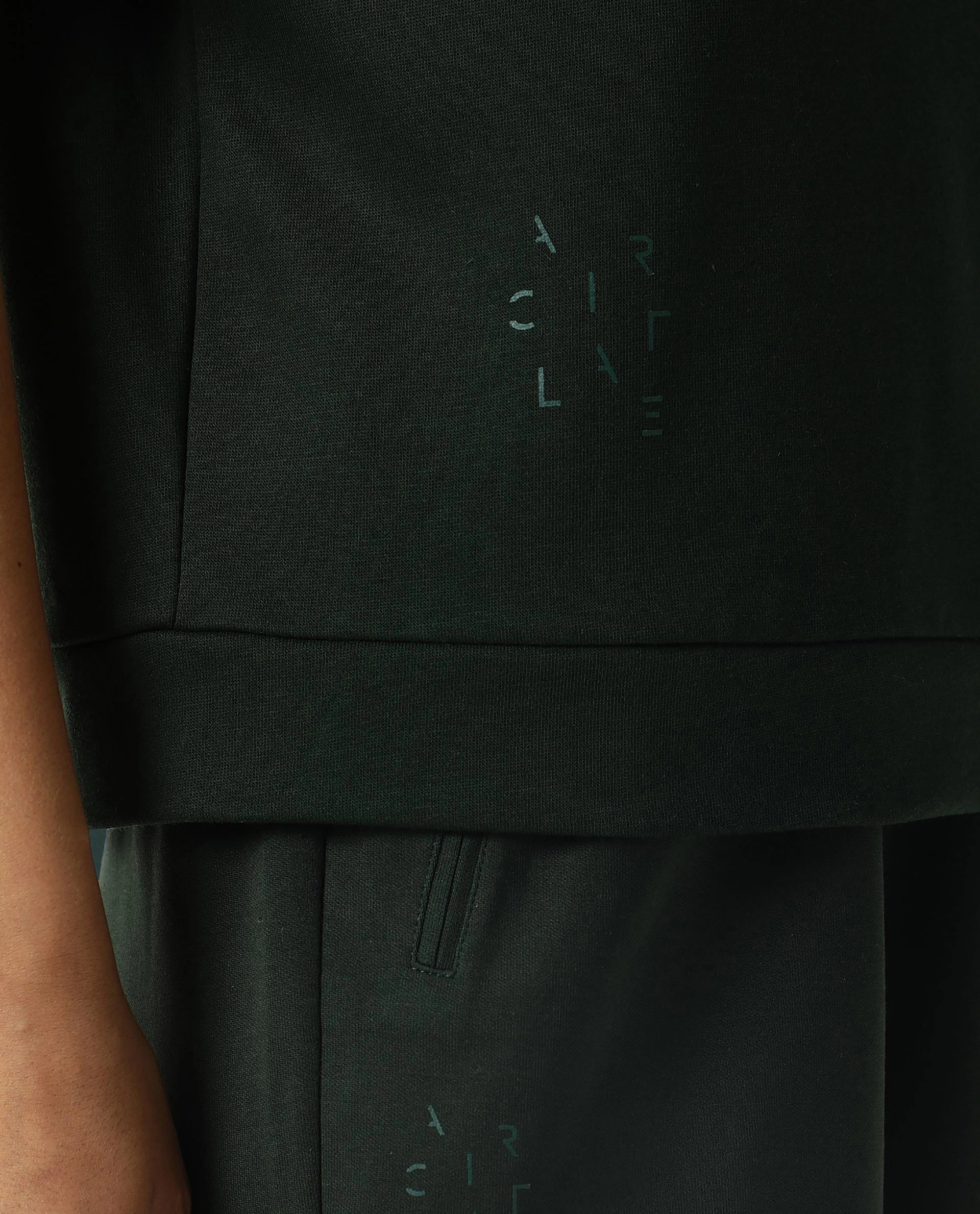 Rareism Women Coco Dark Green Cotton Fabric Half Sleeves Relaxed Fit Solid Round Neck Sweat Tee