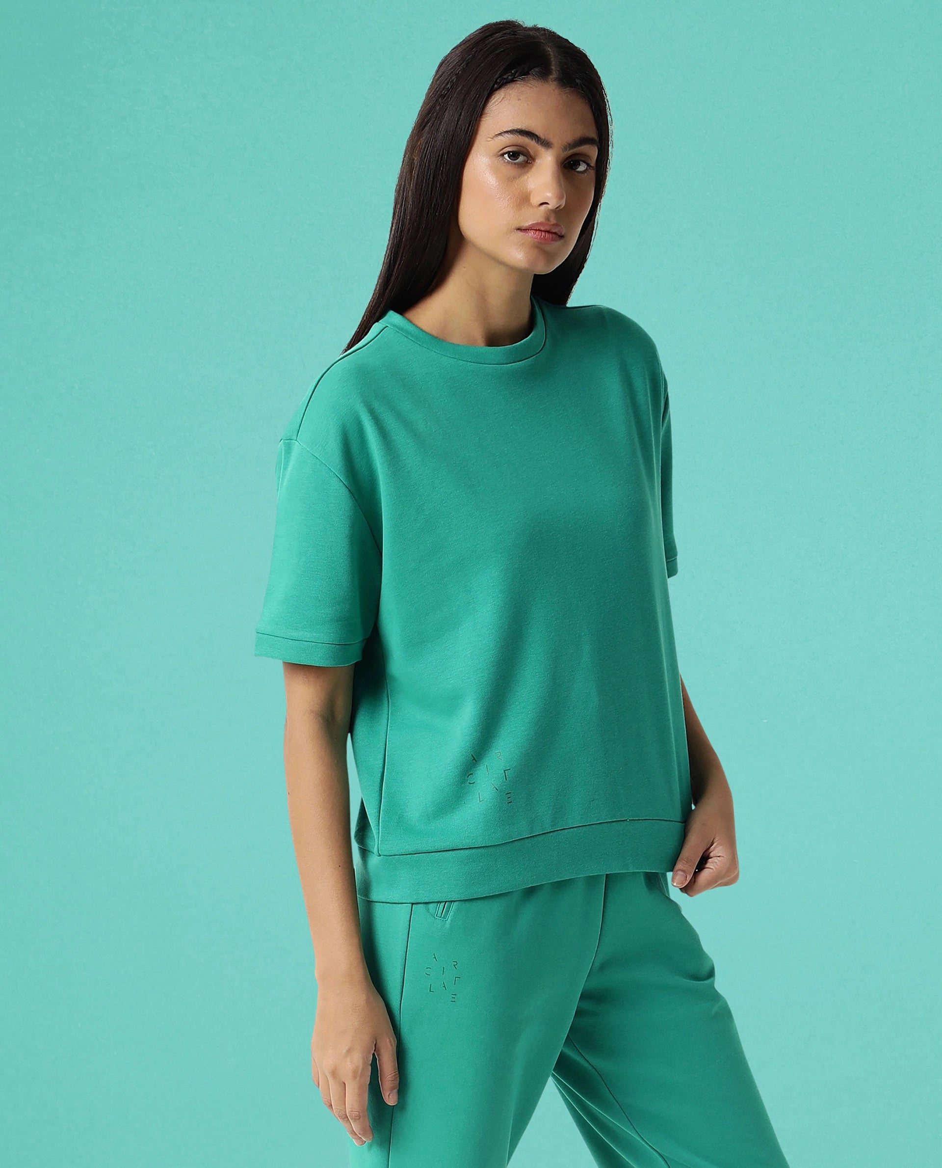 Rareism Women Coco Green Cotton Fabric Half Sleeves Relaxed Fit Solid Round Neck Sweat Tee