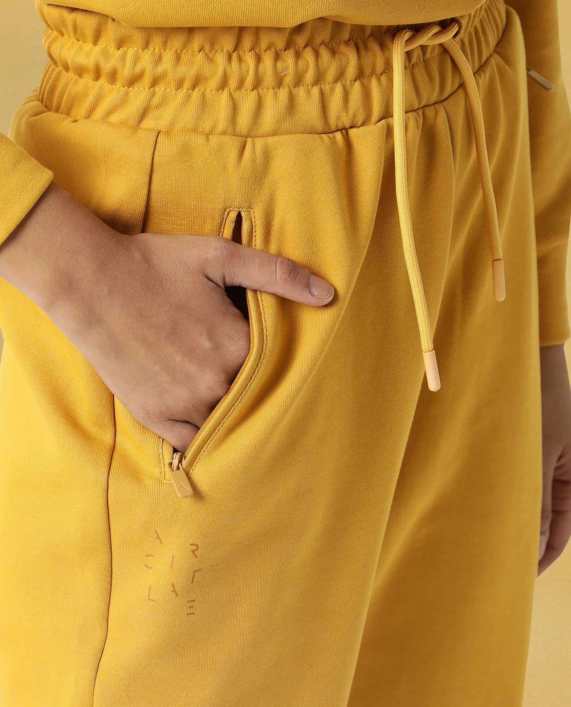 Rareism Women Creta Mustard Cotton Blend Fabric Relaxed Fit Solid Mid Rise Ankle Length Track Pant