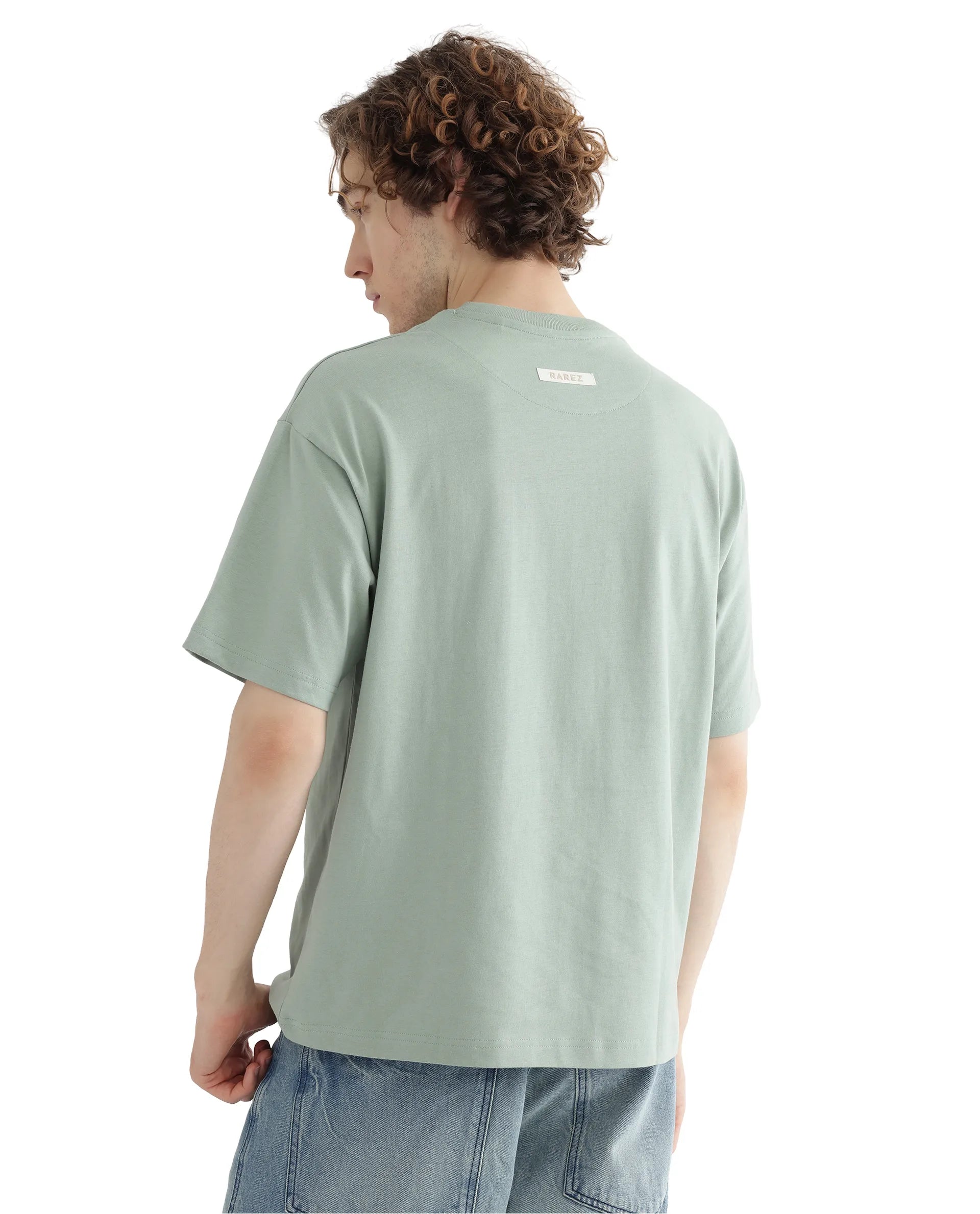 Rare Rabbit Men Deus Dusky Green Cotton Fabric Short Sleeve Boxy Fit HD Print and Applique Detail T-Shirt