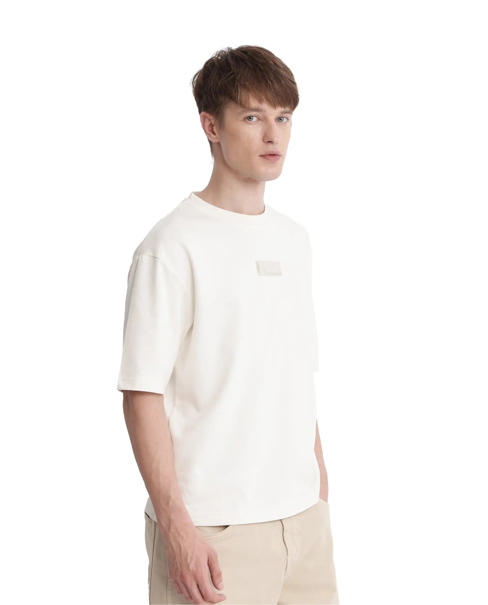 Rare Rabbit Men Endy Off White Cotton Poly Fabric Short Sleeve Boxy Fit Silicone Badge Branding T-Shirt