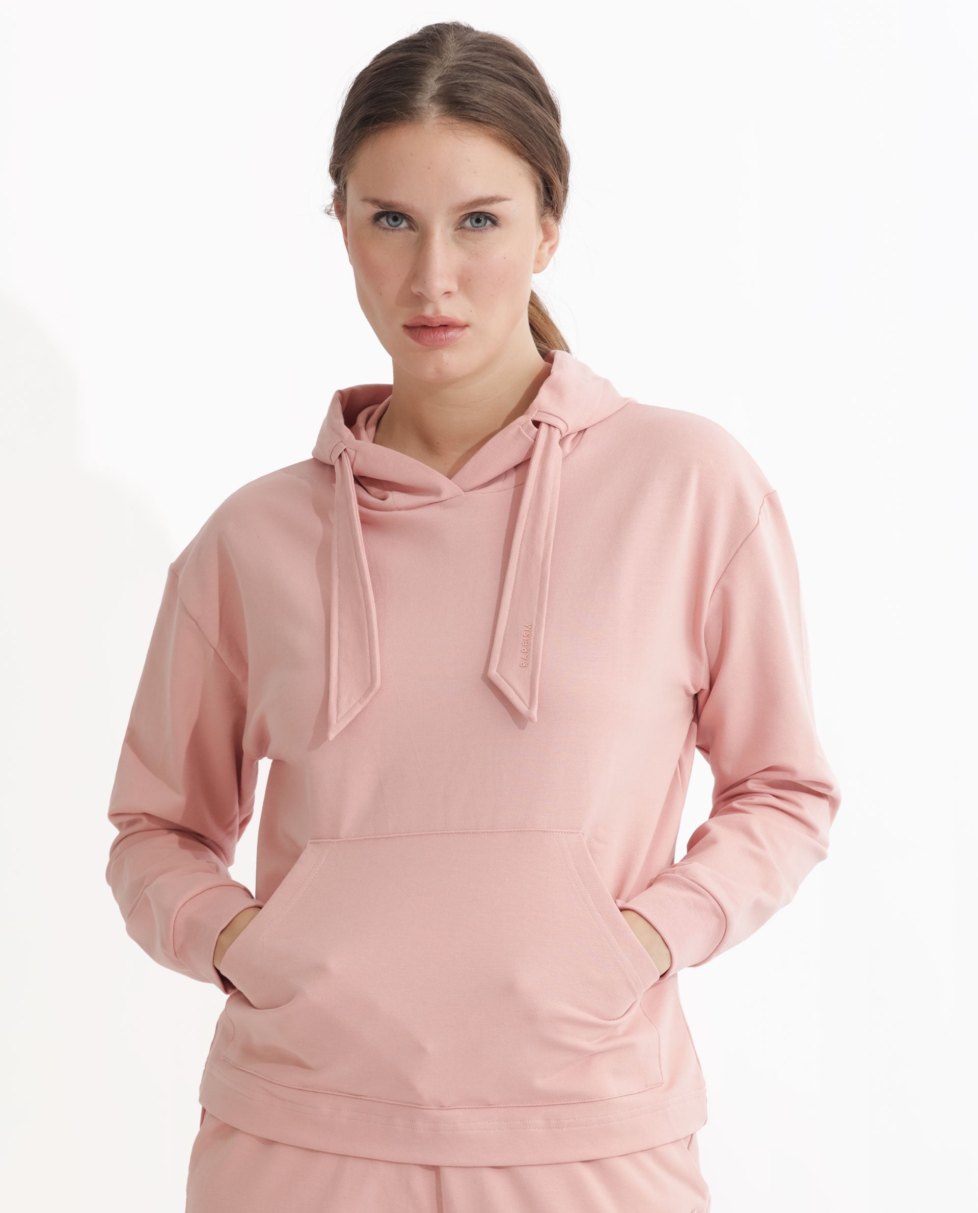 Rareism Women Flynn Light Orange Cotton Lycra Fabric Regular Fit Full Sleeves Solid Hooded Sweatshirt