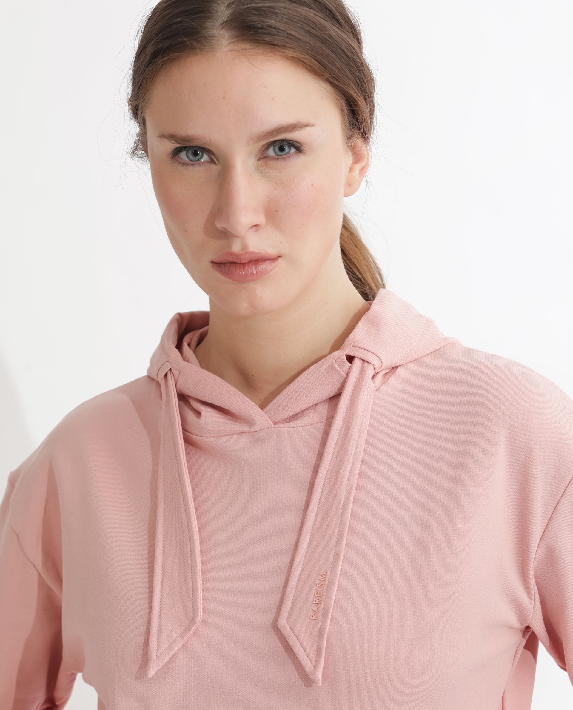 Rareism Women Flynn Light Orange Cotton Lycra Fabric Regular Fit Full Sleeves Solid Hooded Sweatshirt