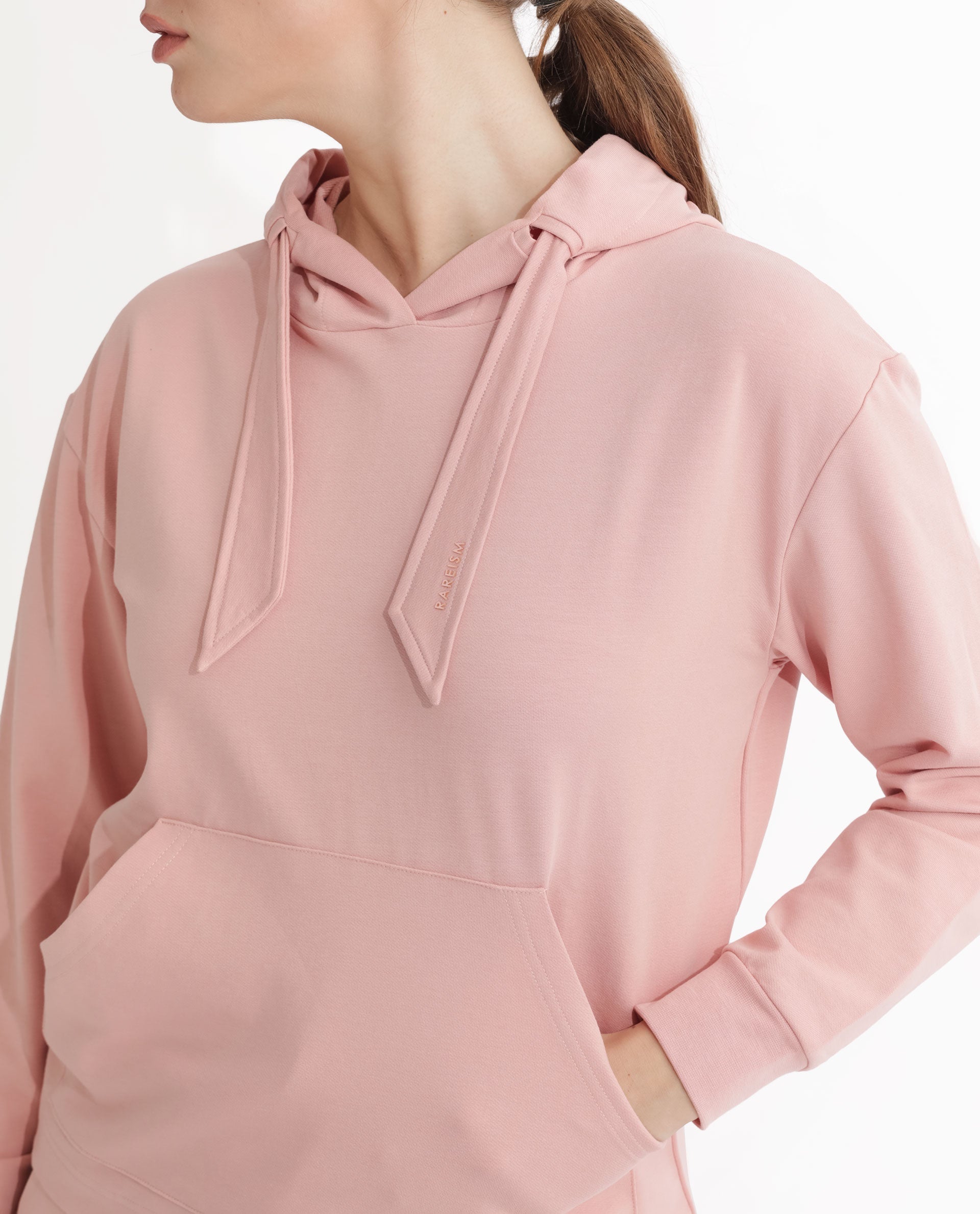 Rareism Women Flynn Light Orange Cotton Lycra Fabric Regular Fit Full Sleeves Solid Hooded Sweatshirt