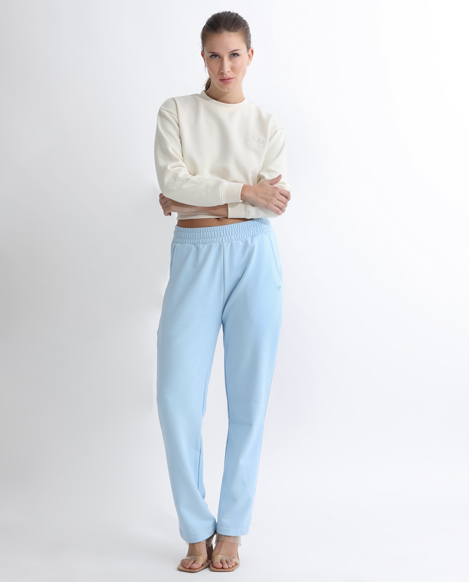 Rareism Women Fronk Light Blue Poly Cotton Fabric Tailored Fit Solid Mid Rise Ankle Length Track Pant