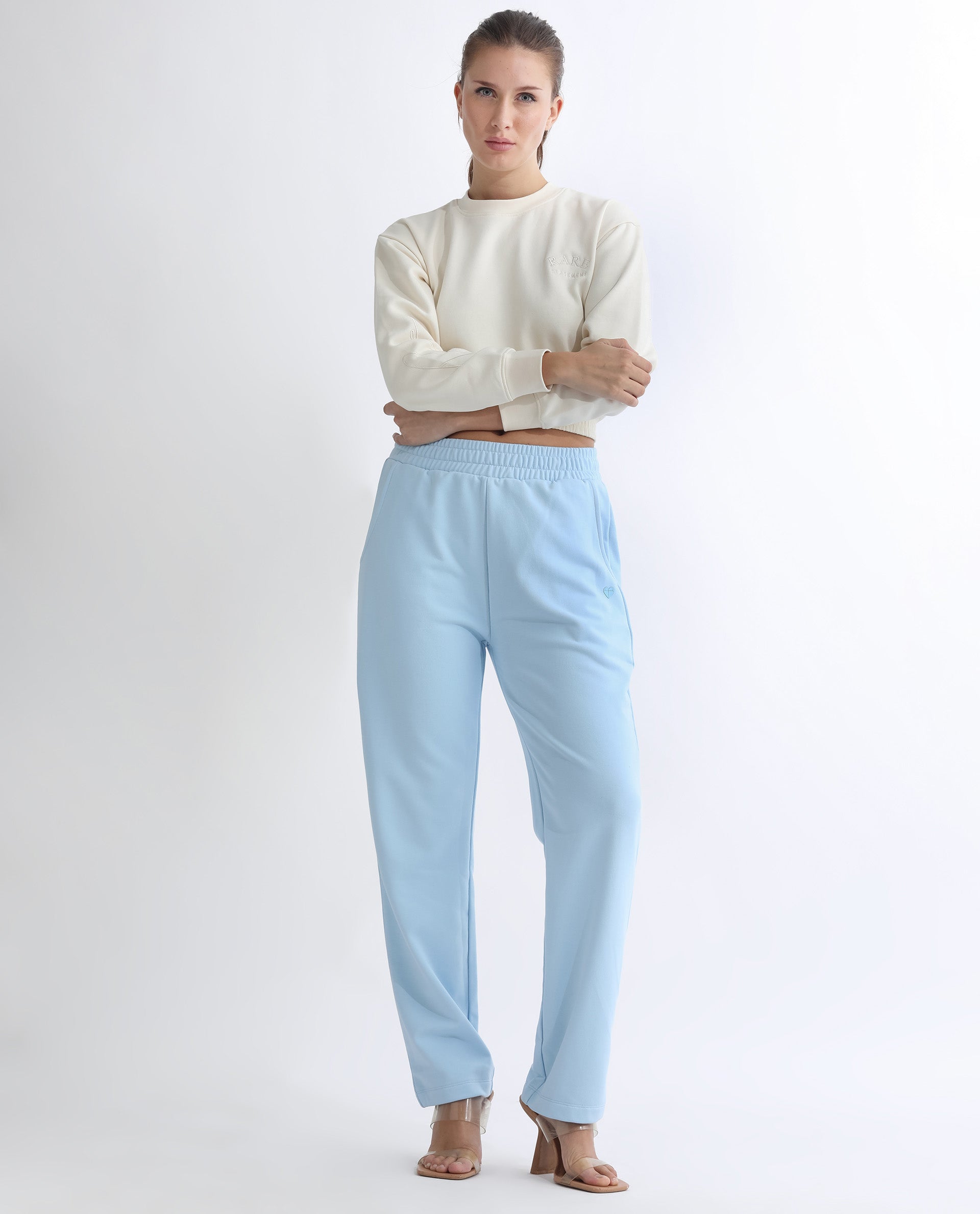 Rareism Women Fronk Light Blue Poly Cotton Fabric Tailored Fit Solid Mid Rise Ankle Length Track Pant