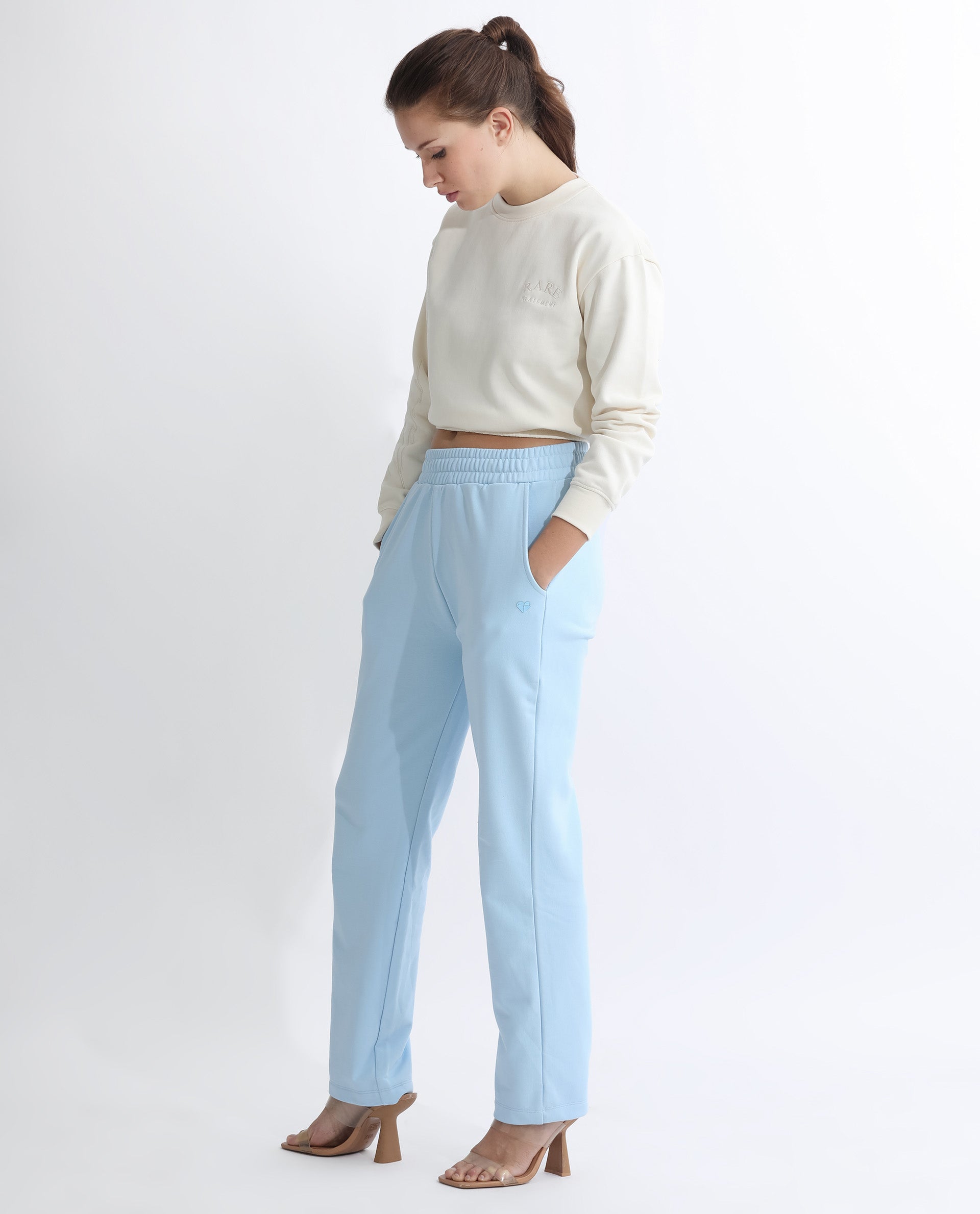 Rareism Women Fronk Light Blue Poly Cotton Fabric Tailored Fit Solid Mid Rise Ankle Length Track Pant