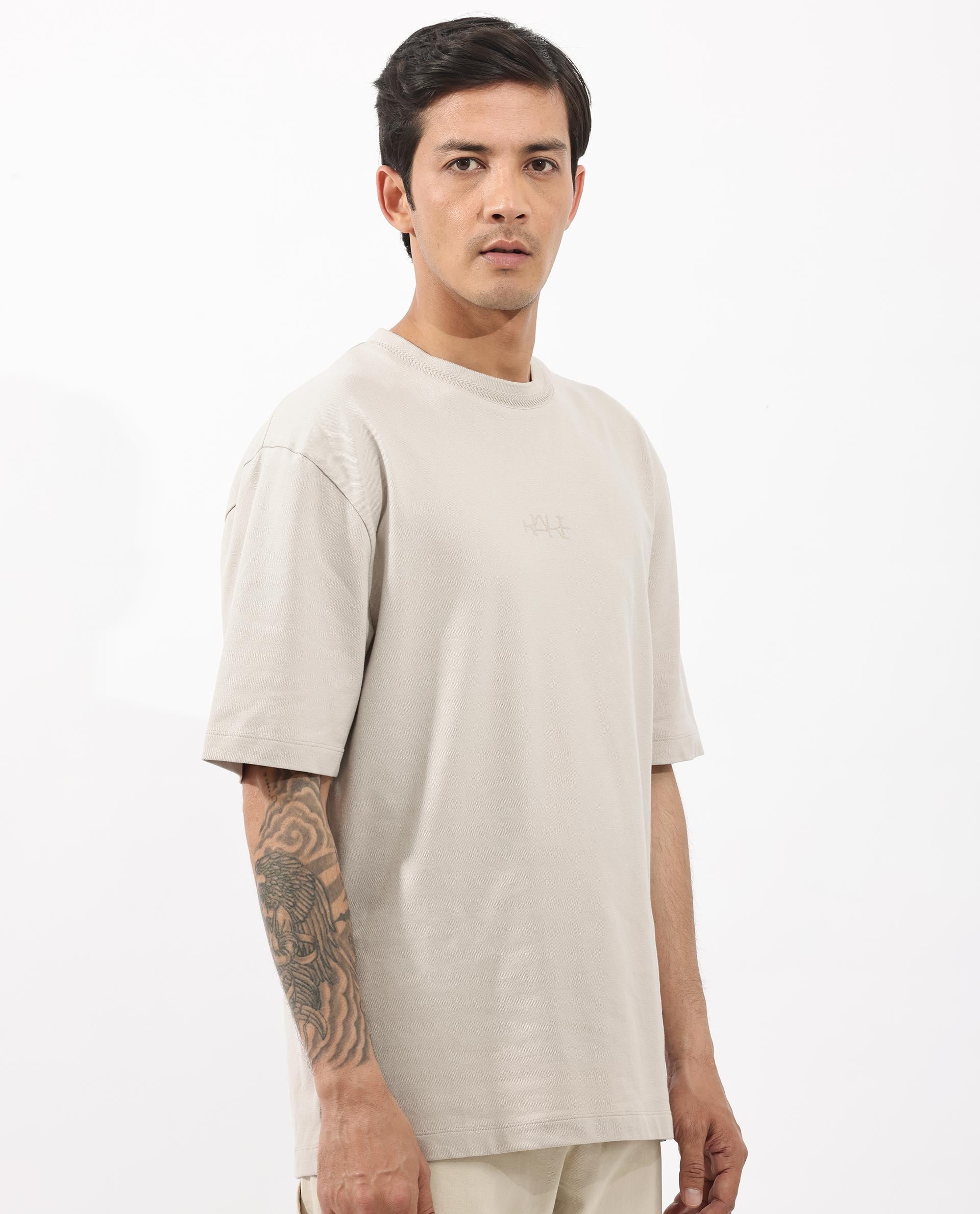 Rare Rabbit Mens Heros Beige Cotton Lycra Fabric Blend Drop Shoulder Short Sleeve Oversized Fit Solid T-Shirt