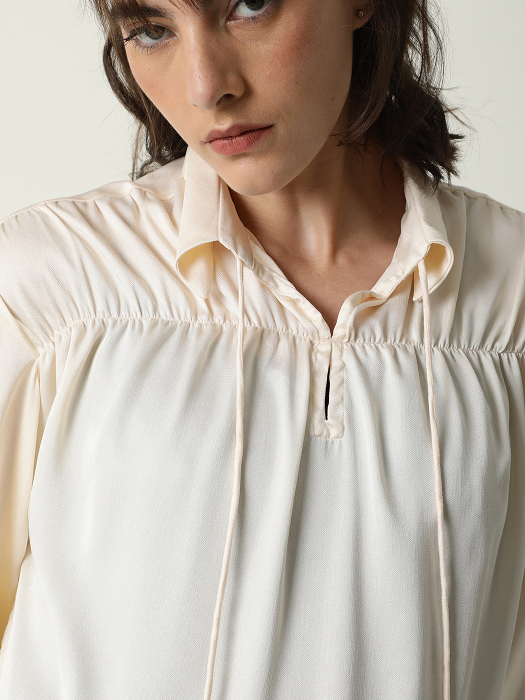 Rareism Women Paxo Off White Poly Cotton Fabric Regular Fit Tie-Up Neck Full Sleeves Solid Top