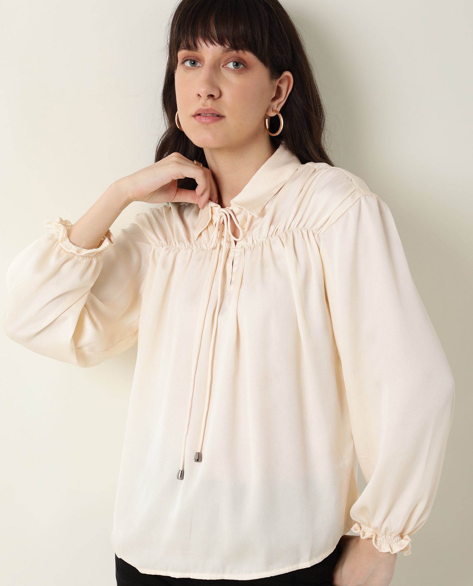 Rareism Women Paxo Off White Poly Cotton Fabric Regular Fit Tie-Up Neck Full Sleeves Solid Top