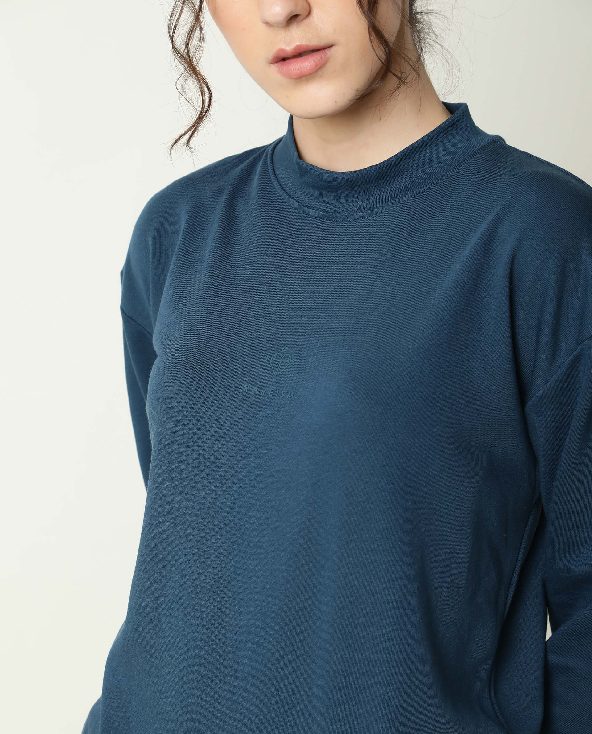 Rareism Women Necker Petrol Relaxed Fit Full Sleeves Solid High Neck Sweatshirt