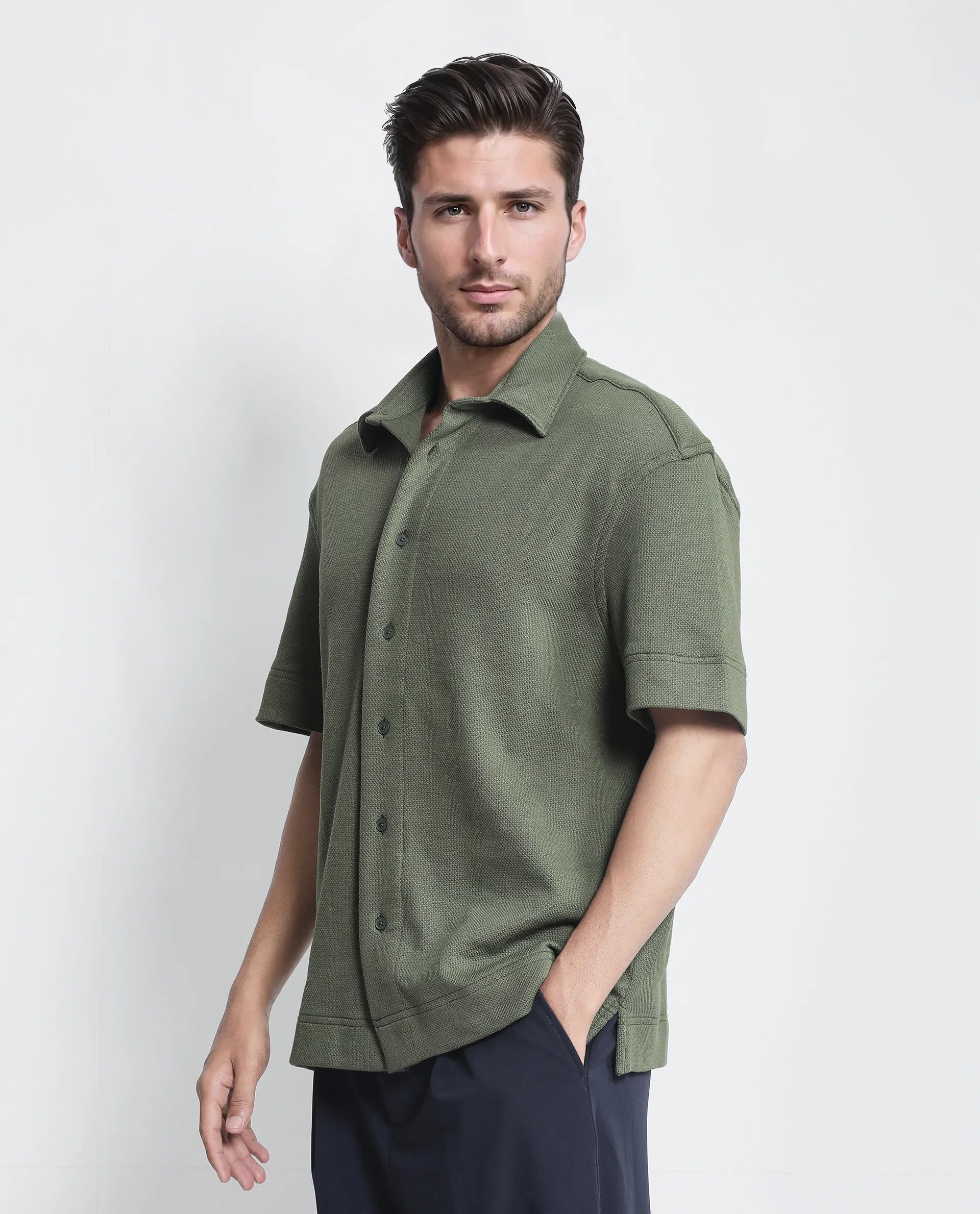 Rare Rabbit Men Kash Dark Green Viscose Fabric Half Sleeve Collared Neck Button Closure Oversized Fit Plain Shirt