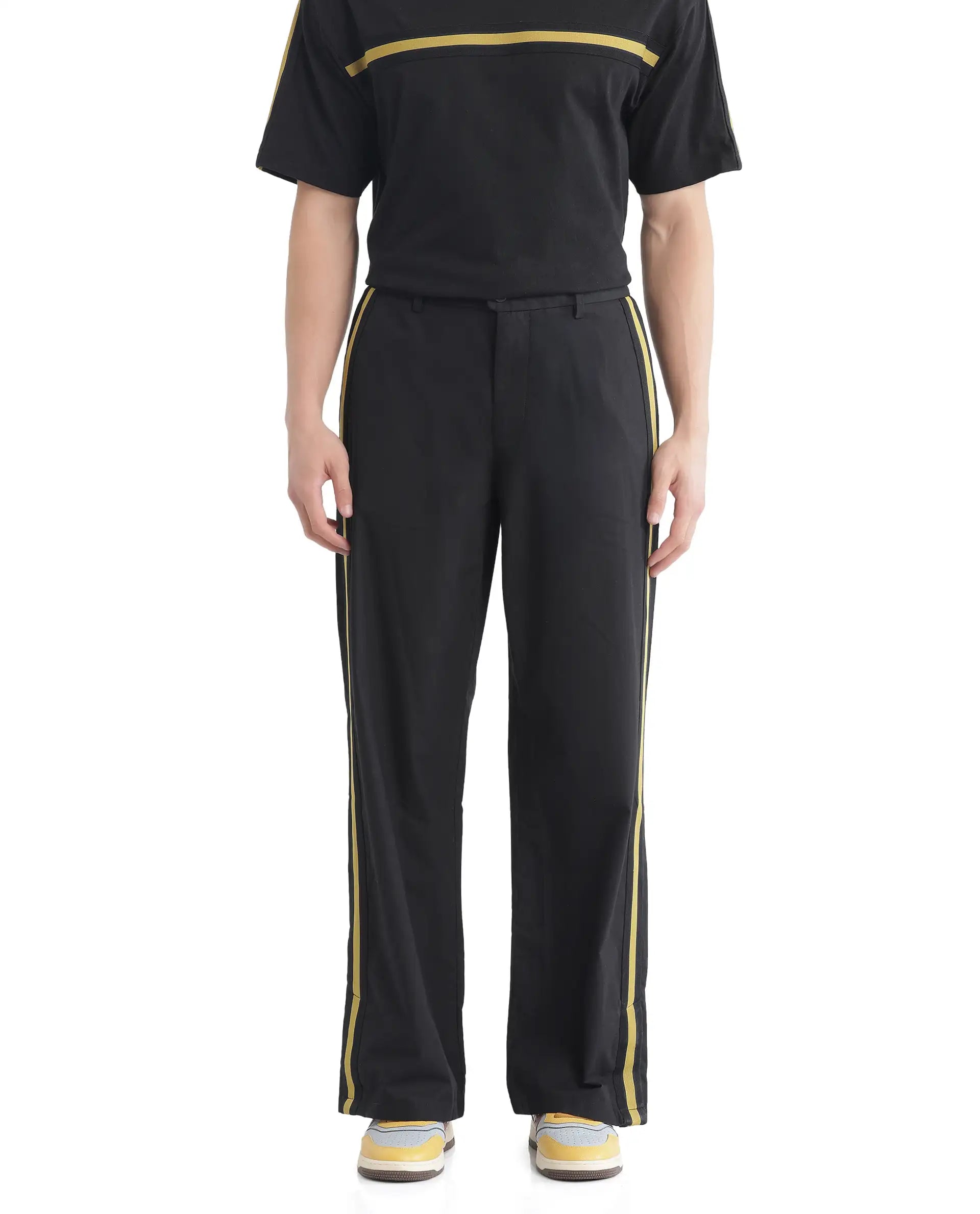 Rare Rabbit Men Newnon Black Cotton Fabric Mid Rise Baggy Fit Side Slit with Snap Button Closure Tape Detailing Track Pant