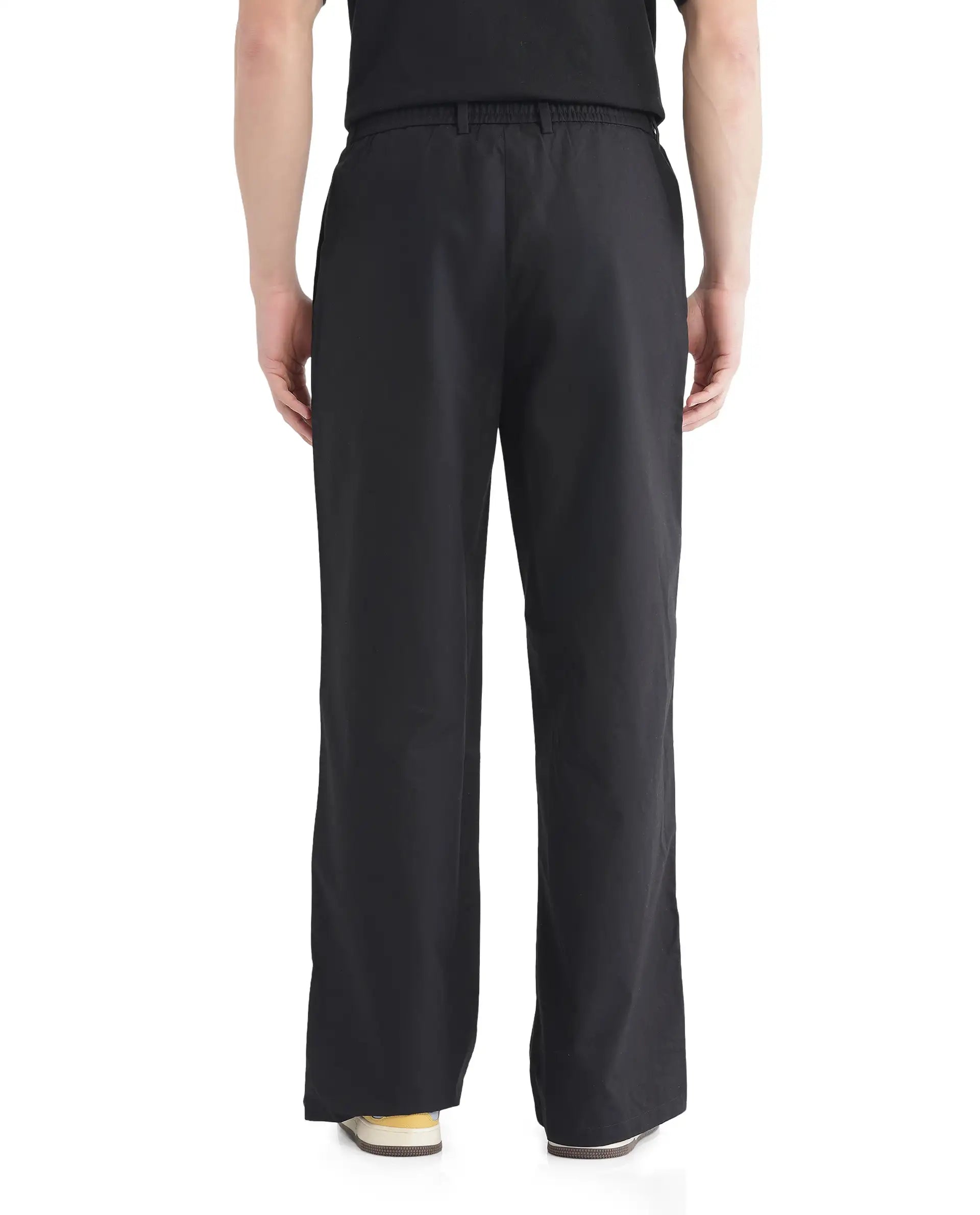 Rare Rabbit Men Newnon Black Cotton Fabric Mid Rise Baggy Fit Side Slit with Snap Button Closure Tape Detailing Track Pant