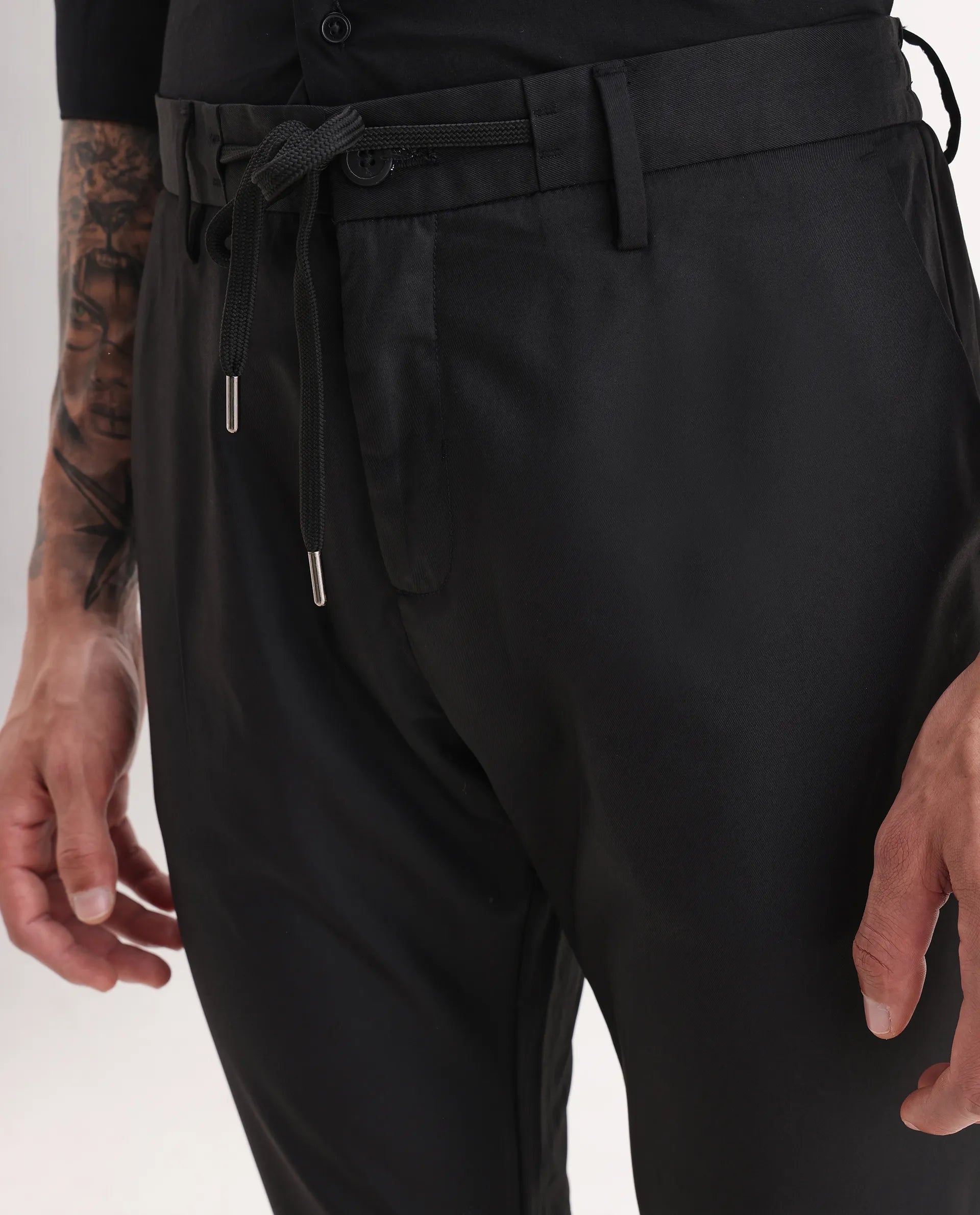 Rare Rabbit Men's Nimb Black Polyester Fabric Drawstring And Button Closure High Rise Regular Fit Solid Trousers