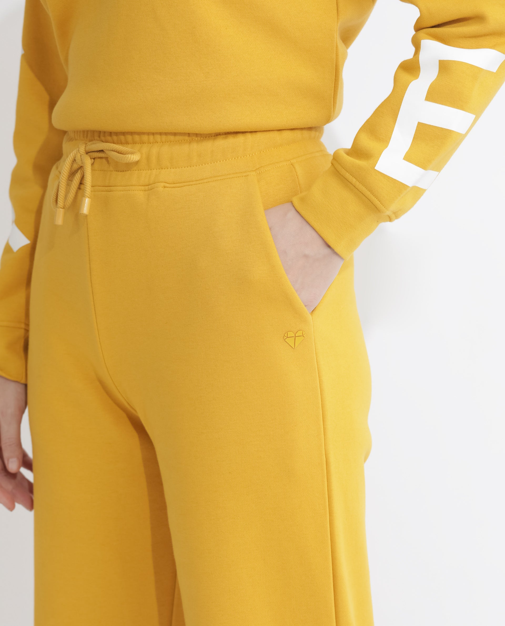 Rareism Women Pazoo F Mustard Cotton Blend Fabric Flared Solid Mid Rise Ankle Length Track Pant