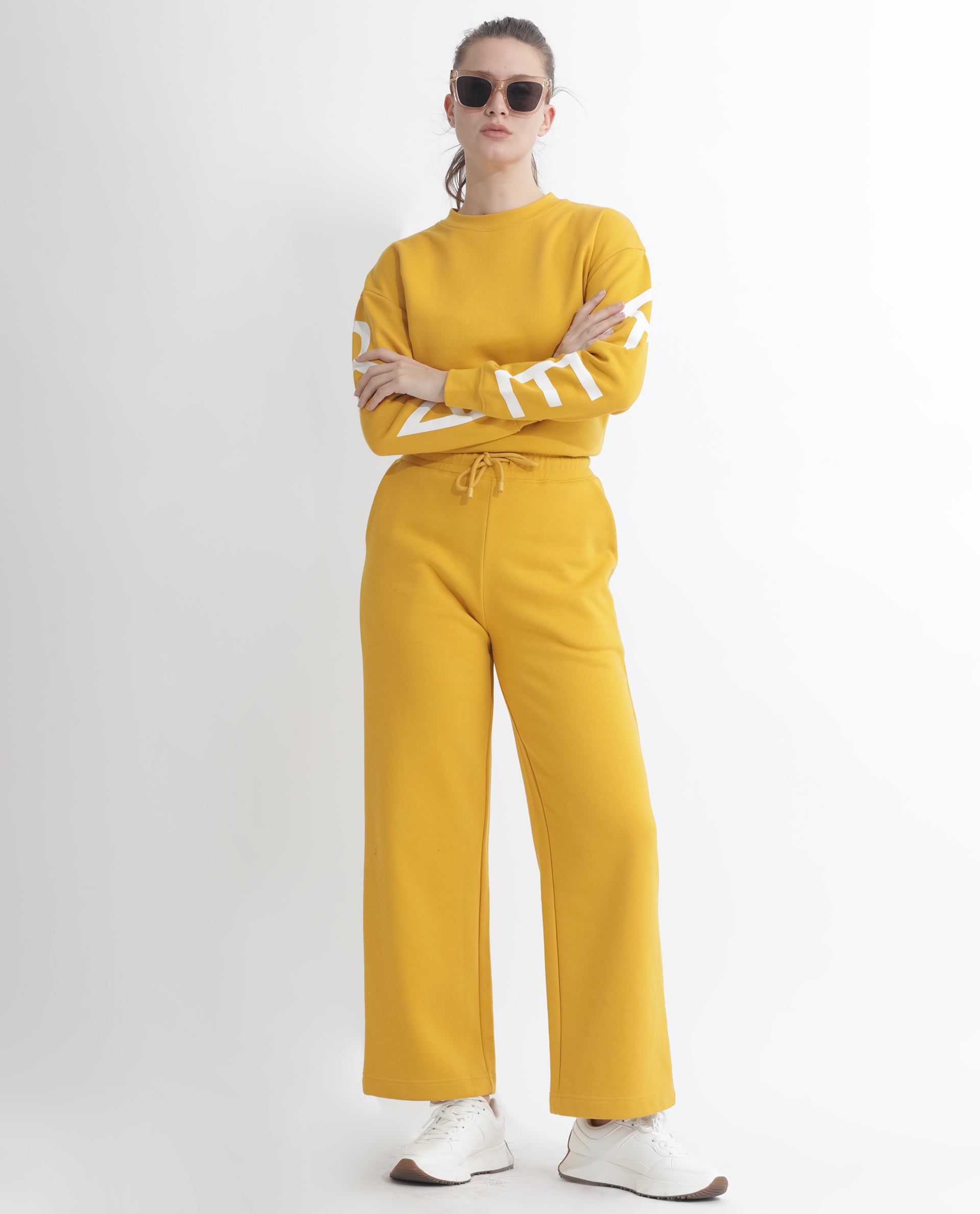 Rareism Women Pazoo F Mustard Cotton Blend Fabric Flared Solid Mid Rise Ankle Length Track Pant