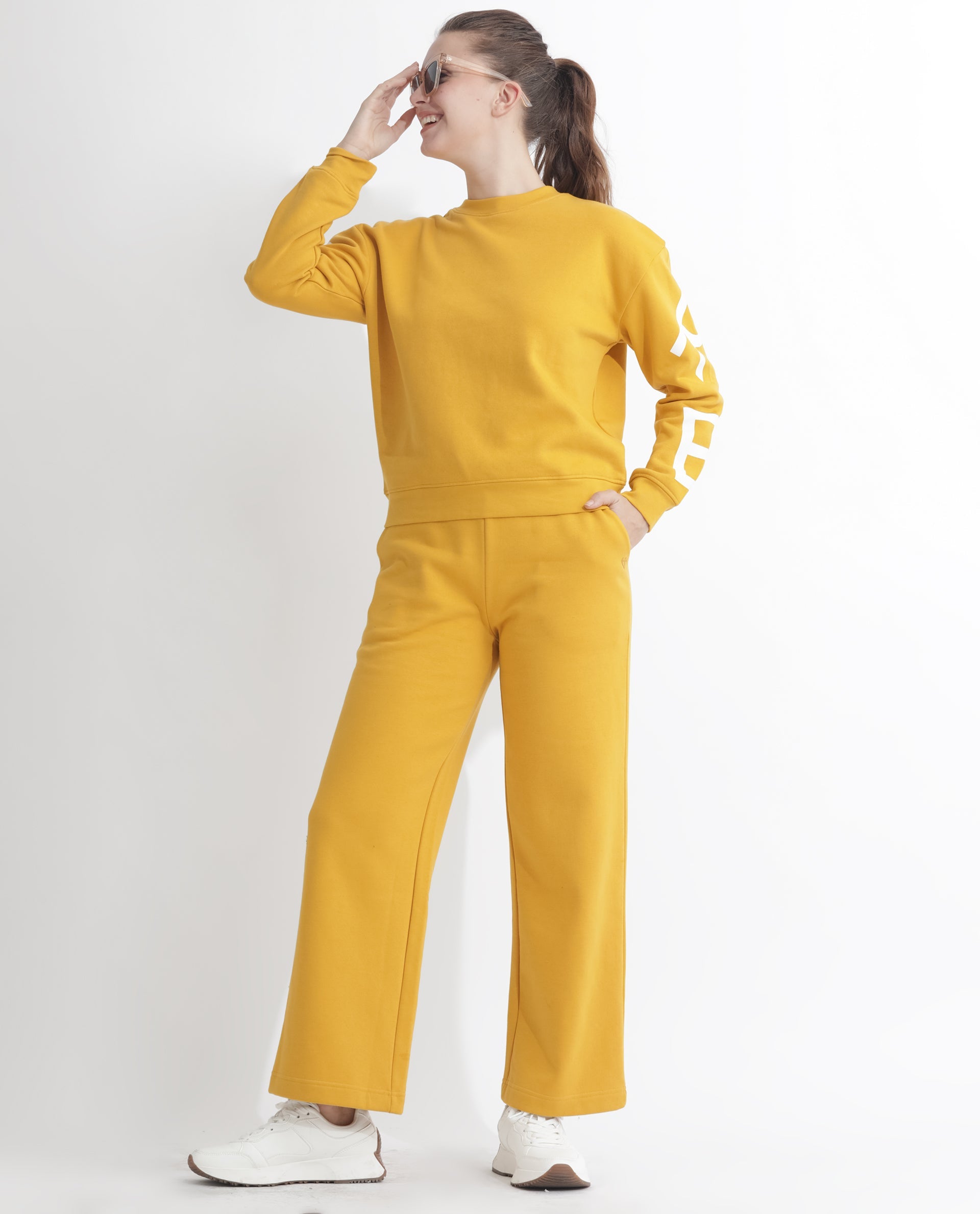 Rareism Women Pazoo F Mustard Cotton Blend Fabric Flared Solid Mid Rise Ankle Length Track Pant