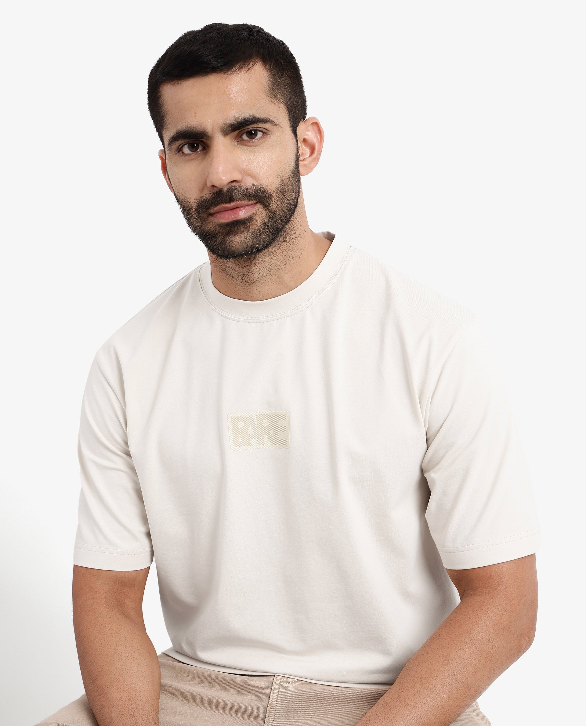 Rare Rabbit Men Reborn-T Beige Cotton Fabric Short Sleeve Crew Neck Oversized Fit Graphic Print T-Shirt