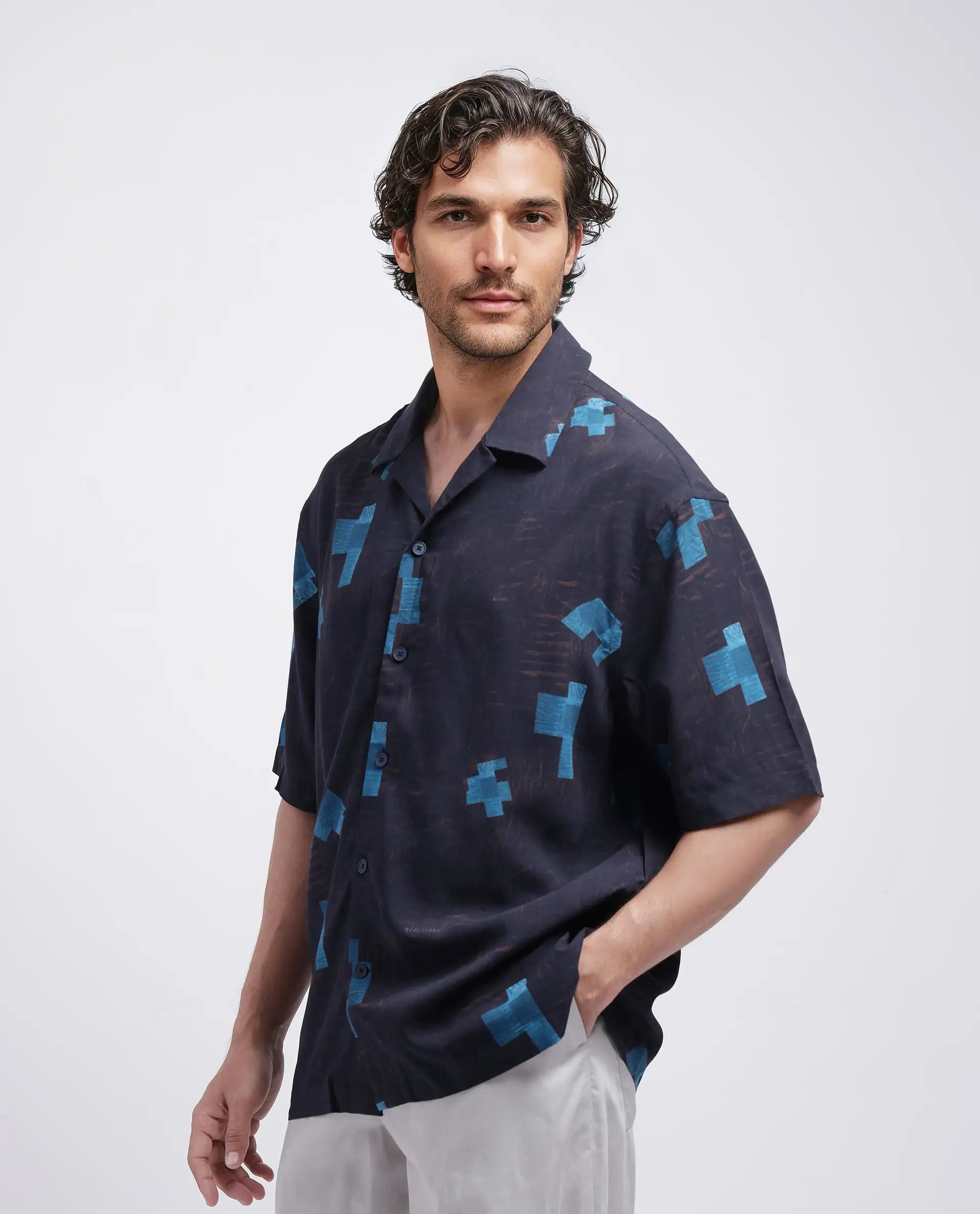 Rare Rabbit Men Riko Dark Brown Viscose Fabric Half Sleeve Cuban Collar Button Closure Oversized Fit Abstract Print Shirt