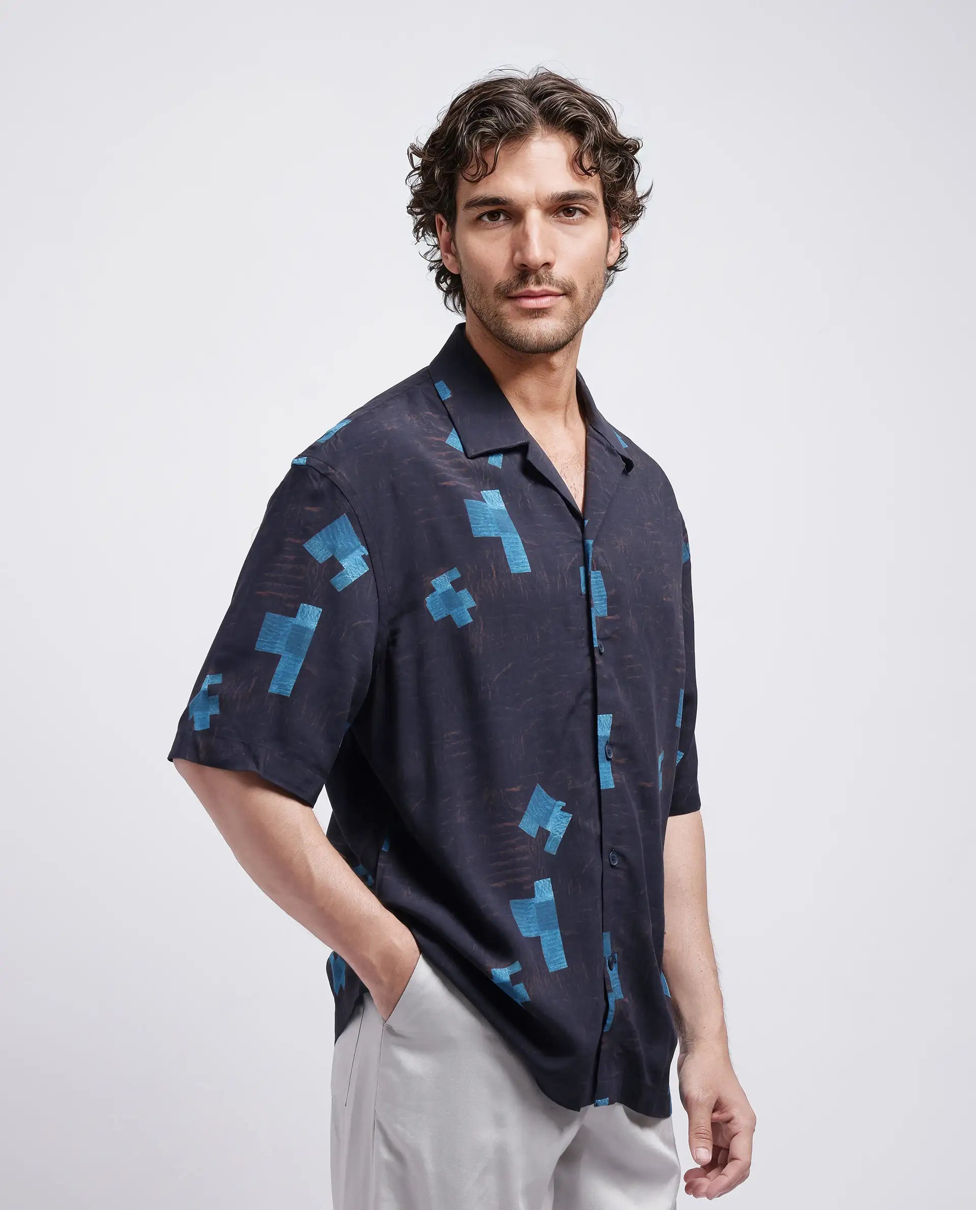 Rare Rabbit Men Riko Dark Brown Viscose Fabric Half Sleeve Cuban Collar Button Closure Oversized Fit Abstract Print Shirt