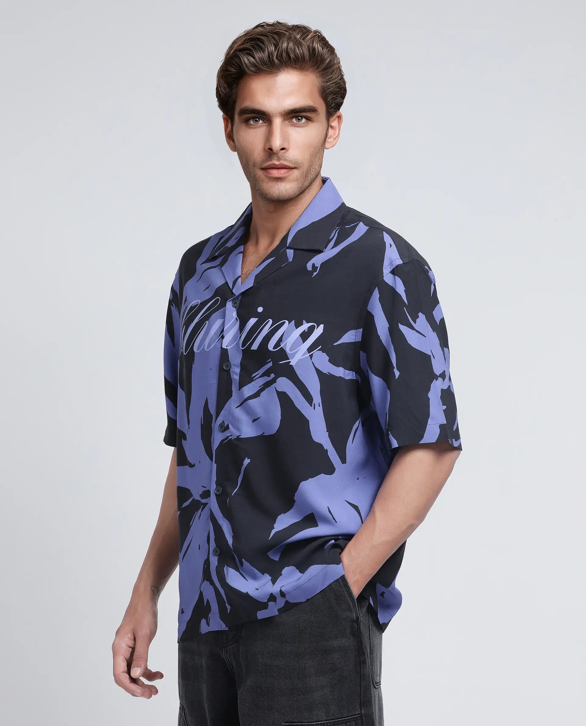 Rare Rabbit Men Rinz Black Viscose Fabric Half Sleeve Cuban Collar Button Closure Oversized Fit Placement Print Shirt