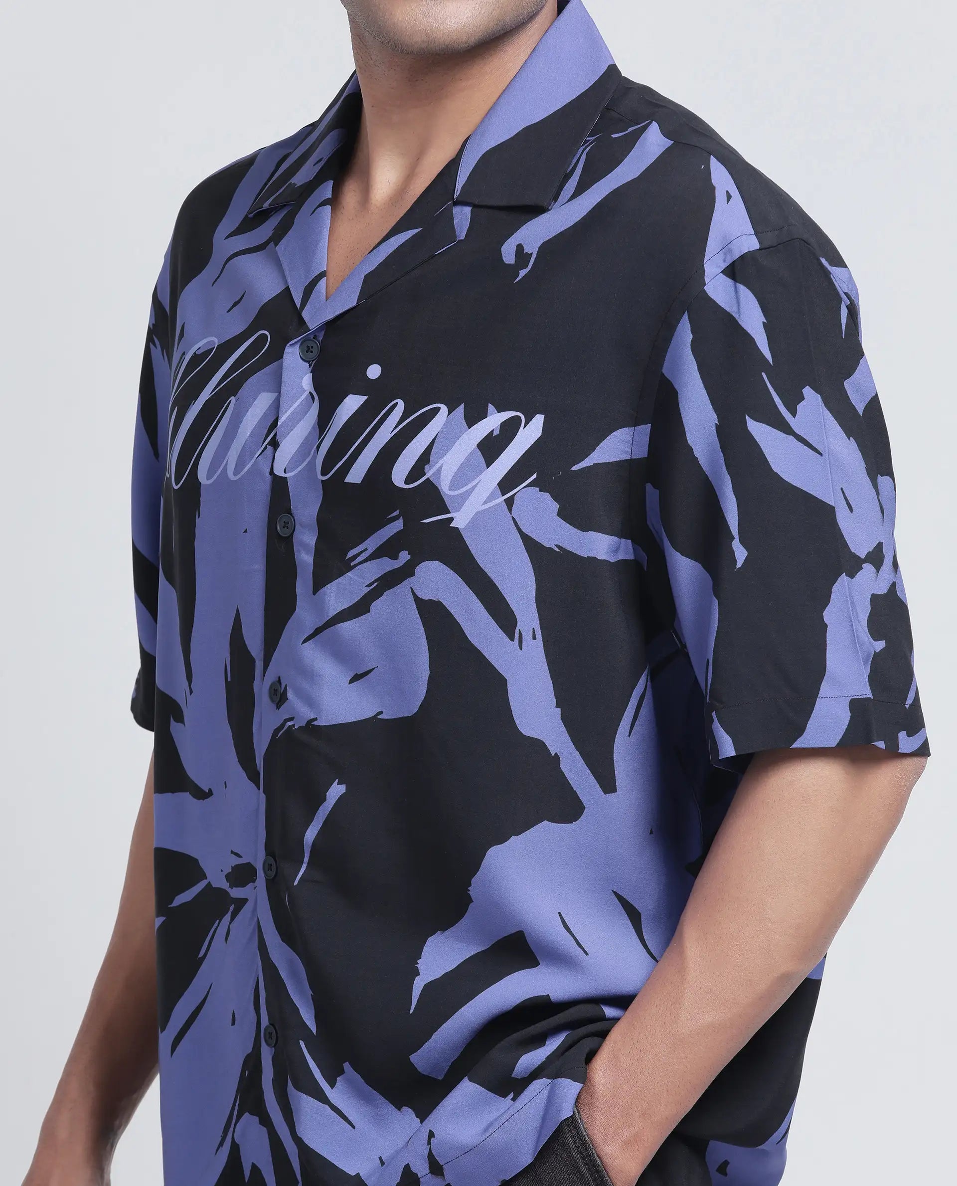 Rare Rabbit Men Rinz Black Viscose Fabric Half Sleeve Cuban Collar Button Closure Oversized Fit Placement Print Shirt