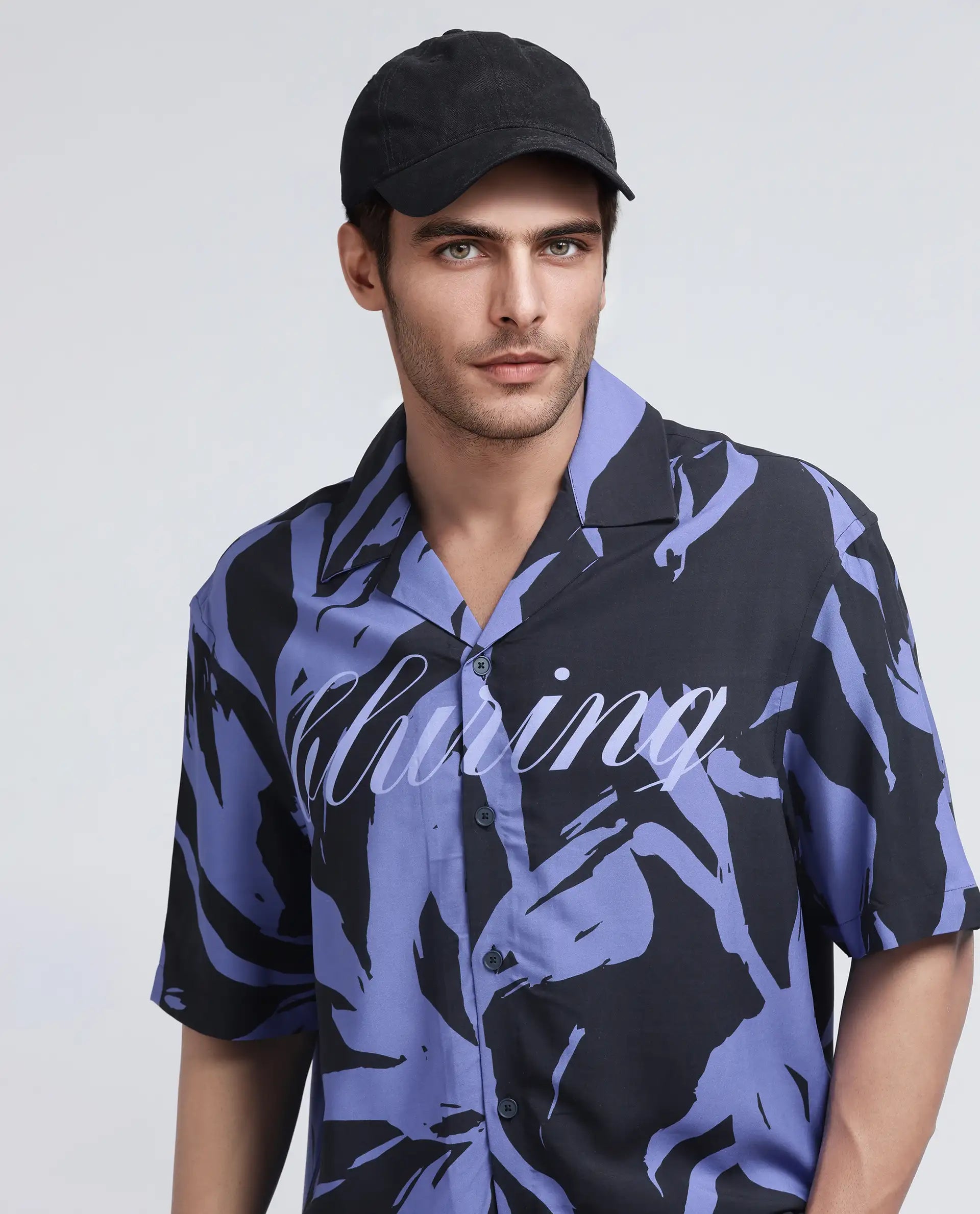 Rare Rabbit Men Rinz Black Viscose Fabric Half Sleeve Cuban Collar Button Closure Oversized Fit Placement Print Shirt