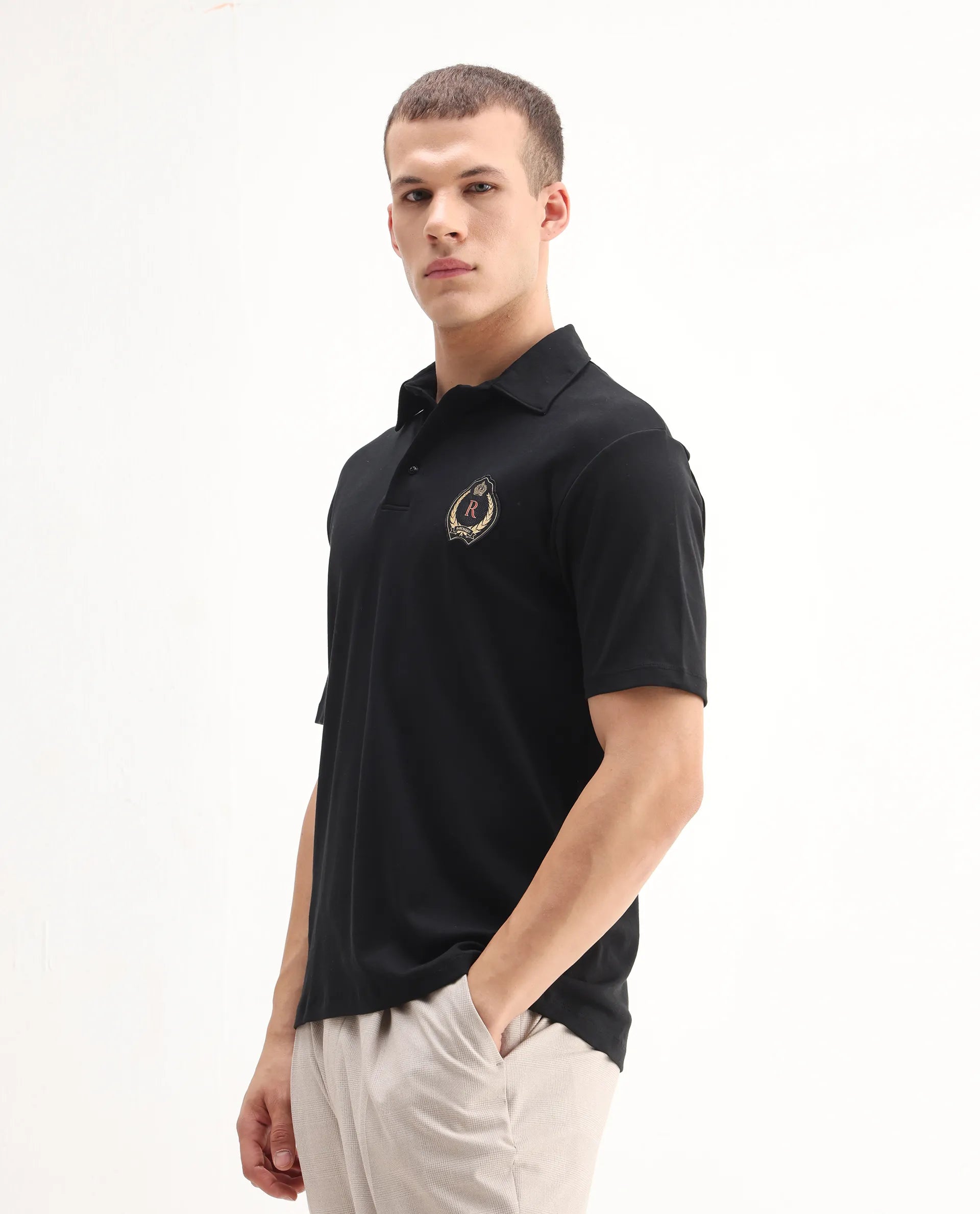 Rare Rabbit Men's Ritz Black` Cotton Plain Regular Fit Half Sleeve Polo