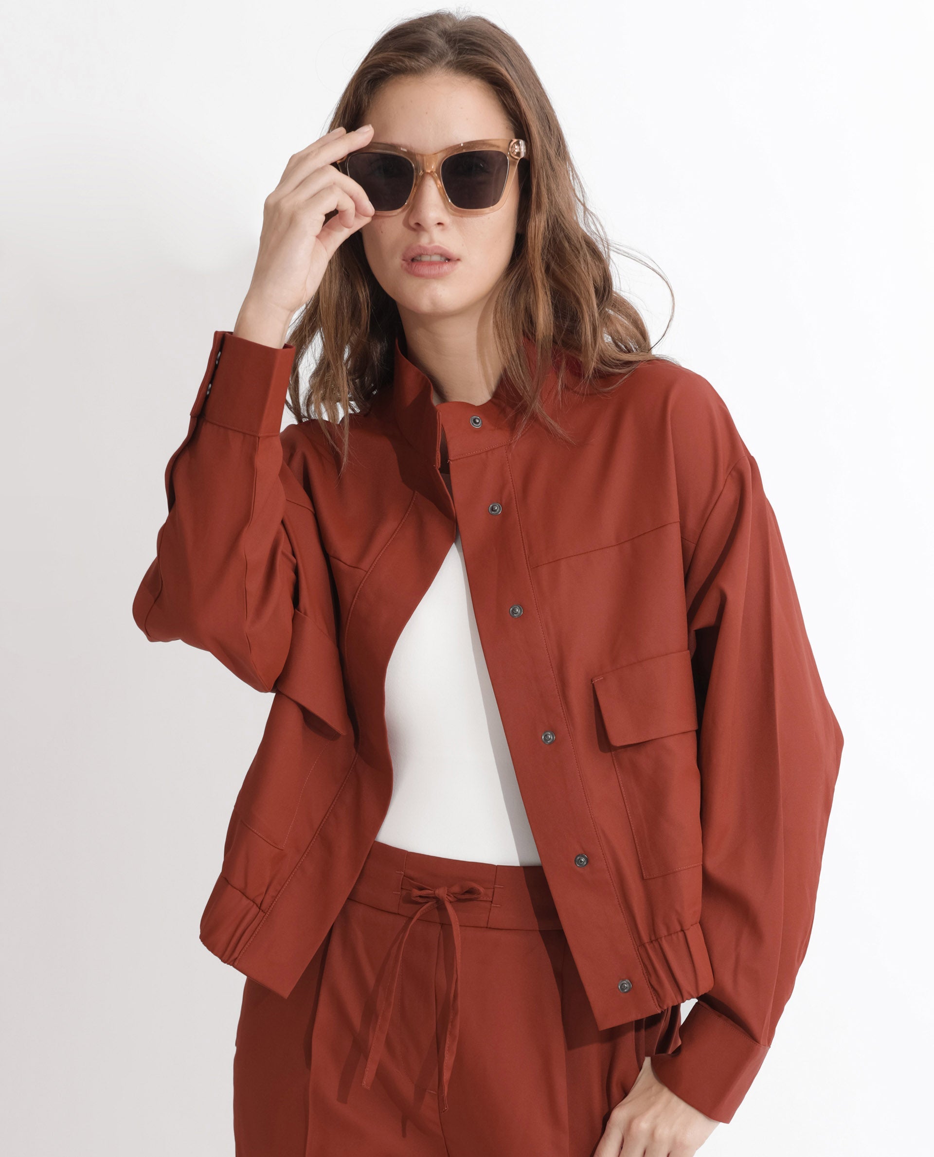 Rareism Articale Women Ruks Rust Polyester Fabric Full Sleeves Button Closure High Neck Regular Fit Plain Jacket