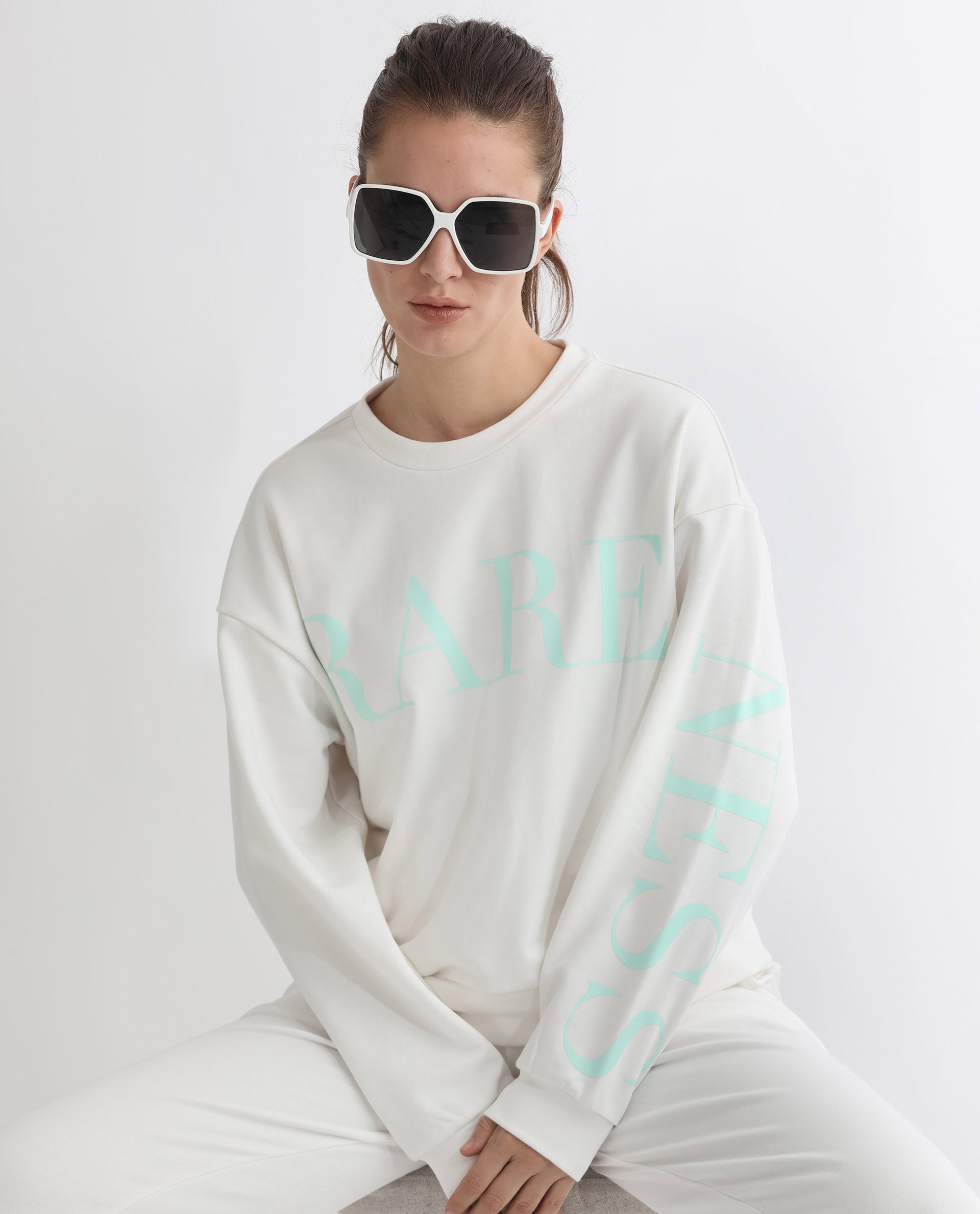 Rareism Articale Women Shelly Off White Poly Cotton Fabric Full Sleeves Cuffed Sleeve Round Neck Relaxed Fit Graphic Print Sweatshirt
