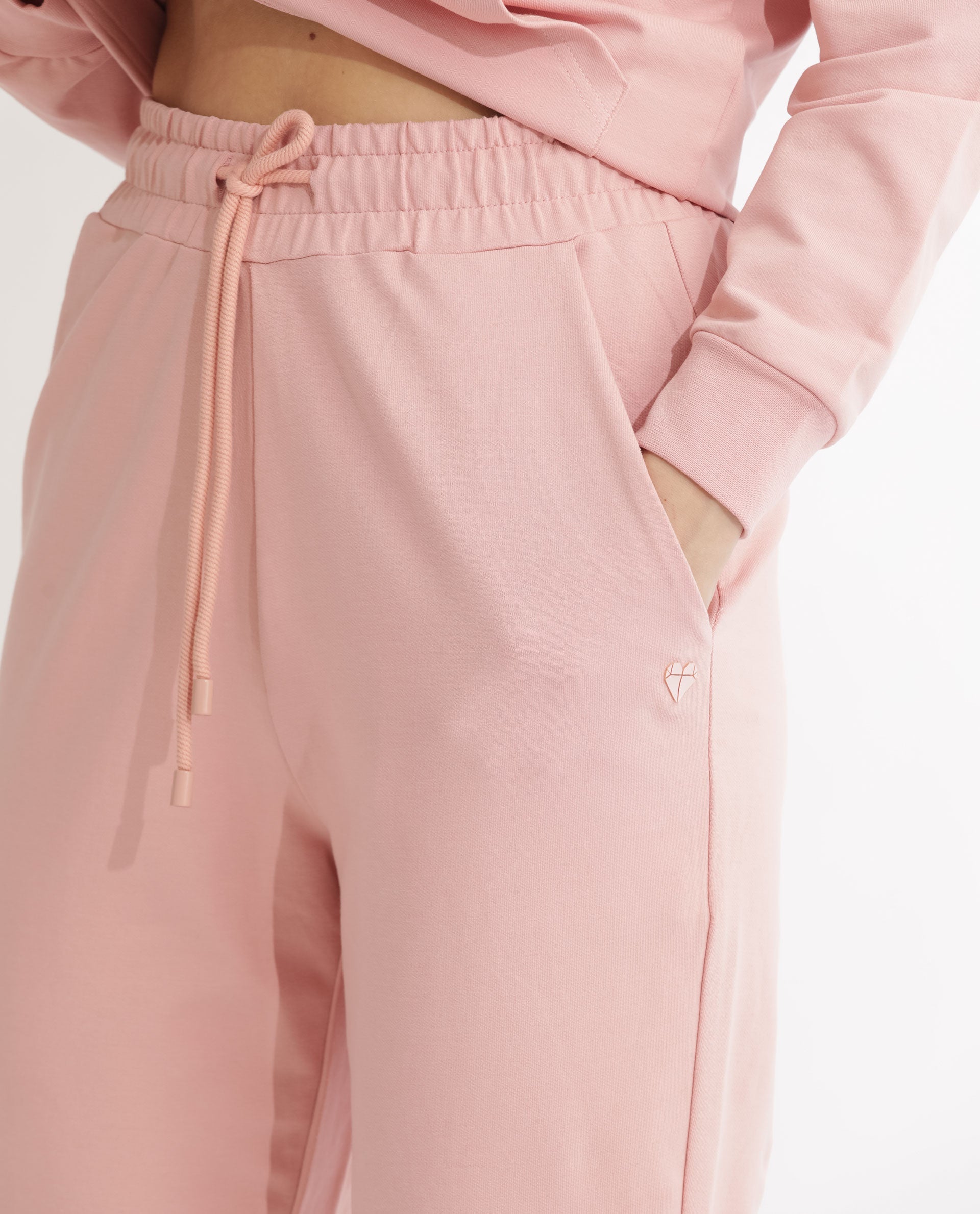 Rareism Women Terac Light Orange Cotton Lycra Fabric Regular Fit Solid Mid Rise Ankle Length Track Pant