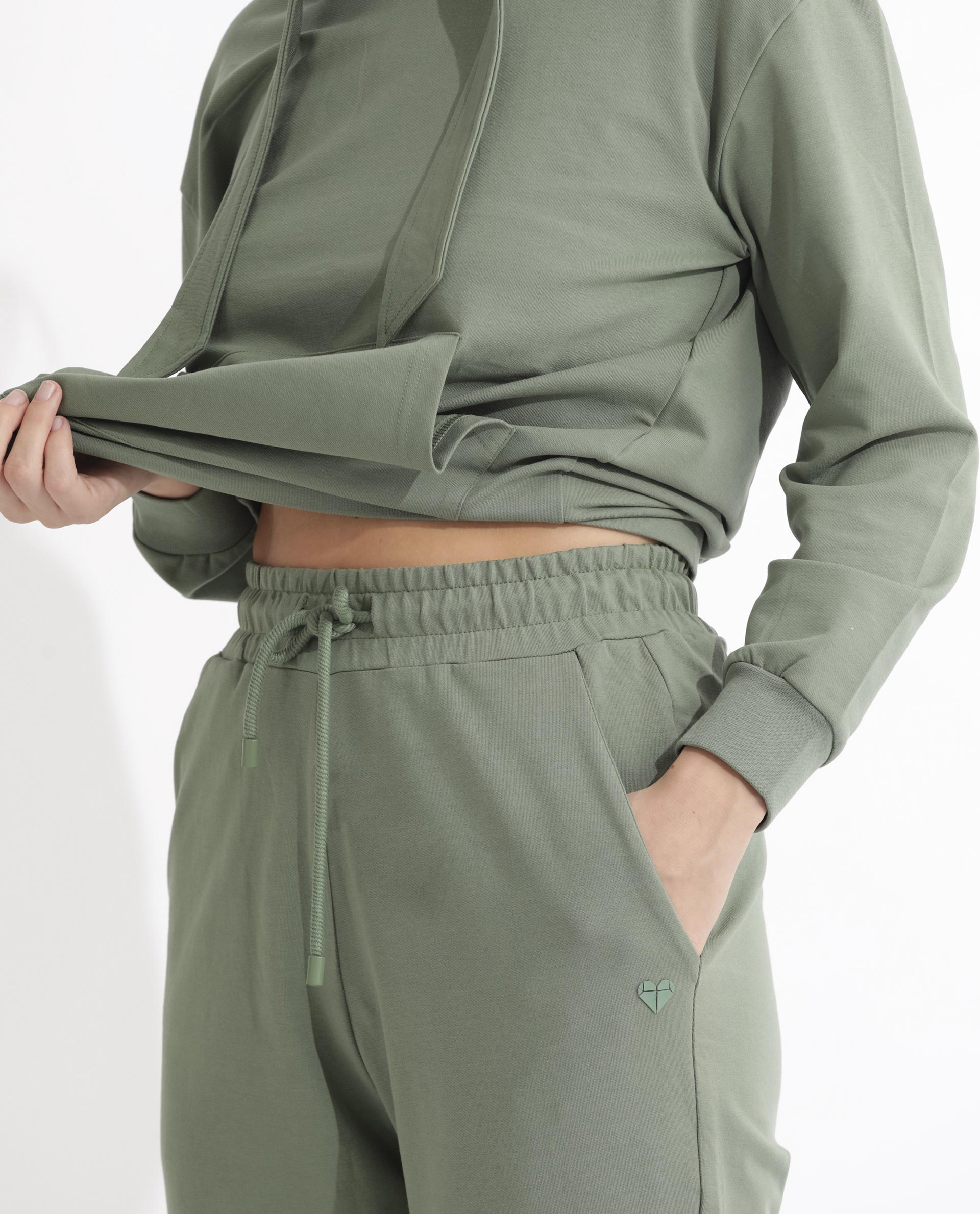 Rareism Women Terac Dusky Green Cotton Lycra Fabric Regular Fit Solid Mid Rise Ankle Length Track Pant