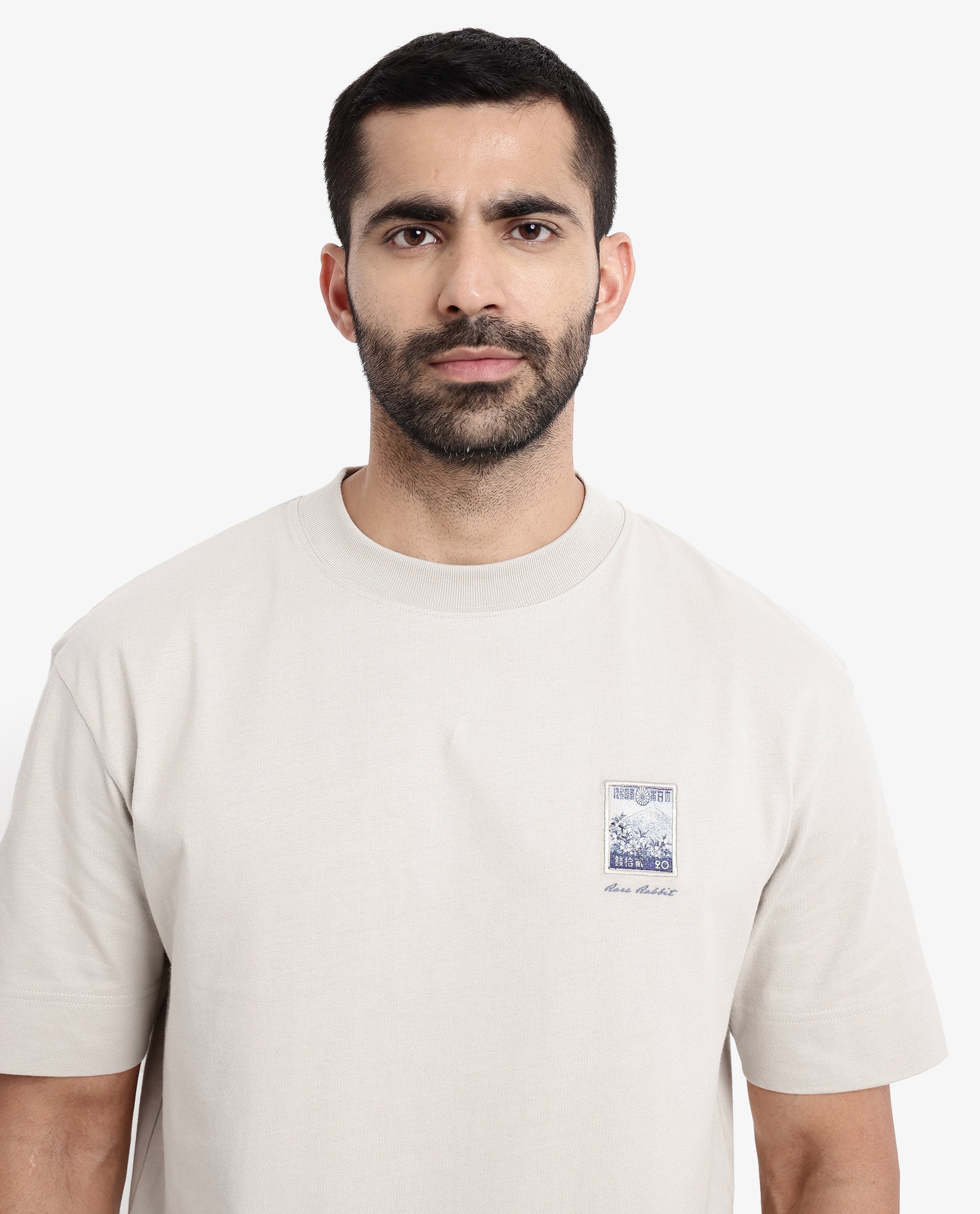 Rare Rabbit Men Trams Beige Cotton Fabric Short Sleeve Crew Neck Oversized Fit Graphic Print T-Shirt