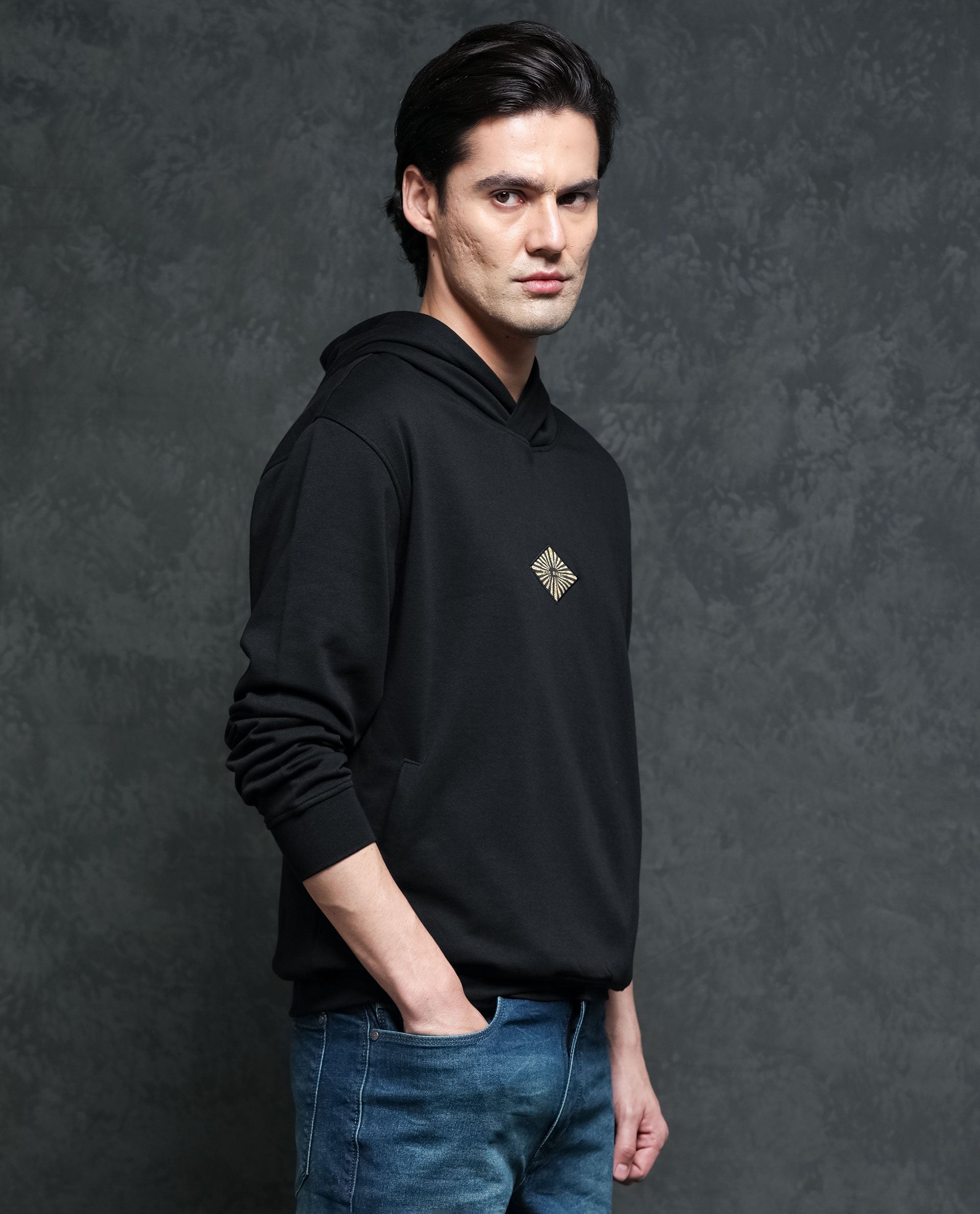 Rare Rabbit Men's Trivial Black Cotton Polyester Fabric Full Sleeves Logo Graphic Badge Hooded Sweatshirt