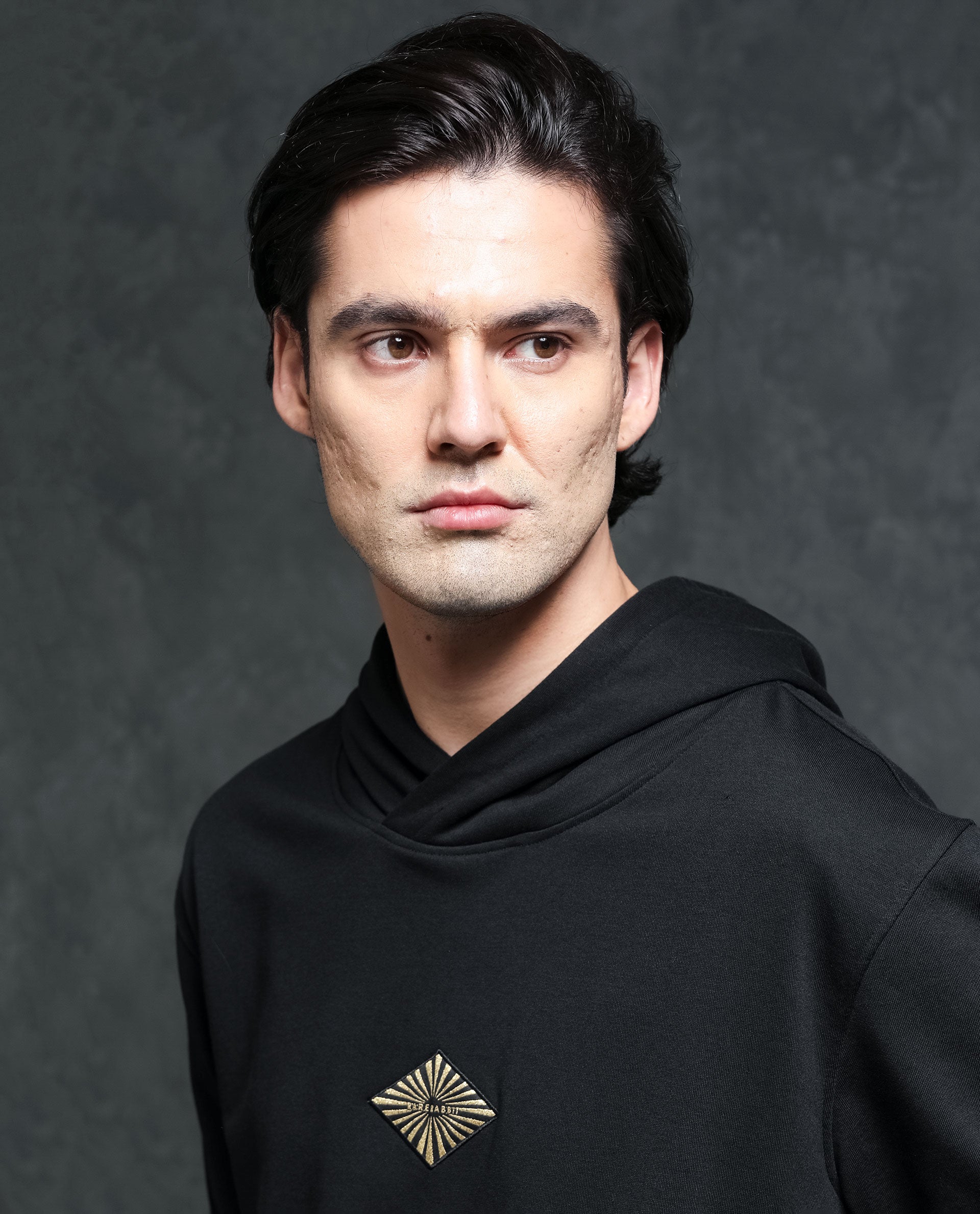 Rare Rabbit Men's Trivial Black Cotton Polyester Fabric Full Sleeves Logo Graphic Badge Hooded Sweatshirt