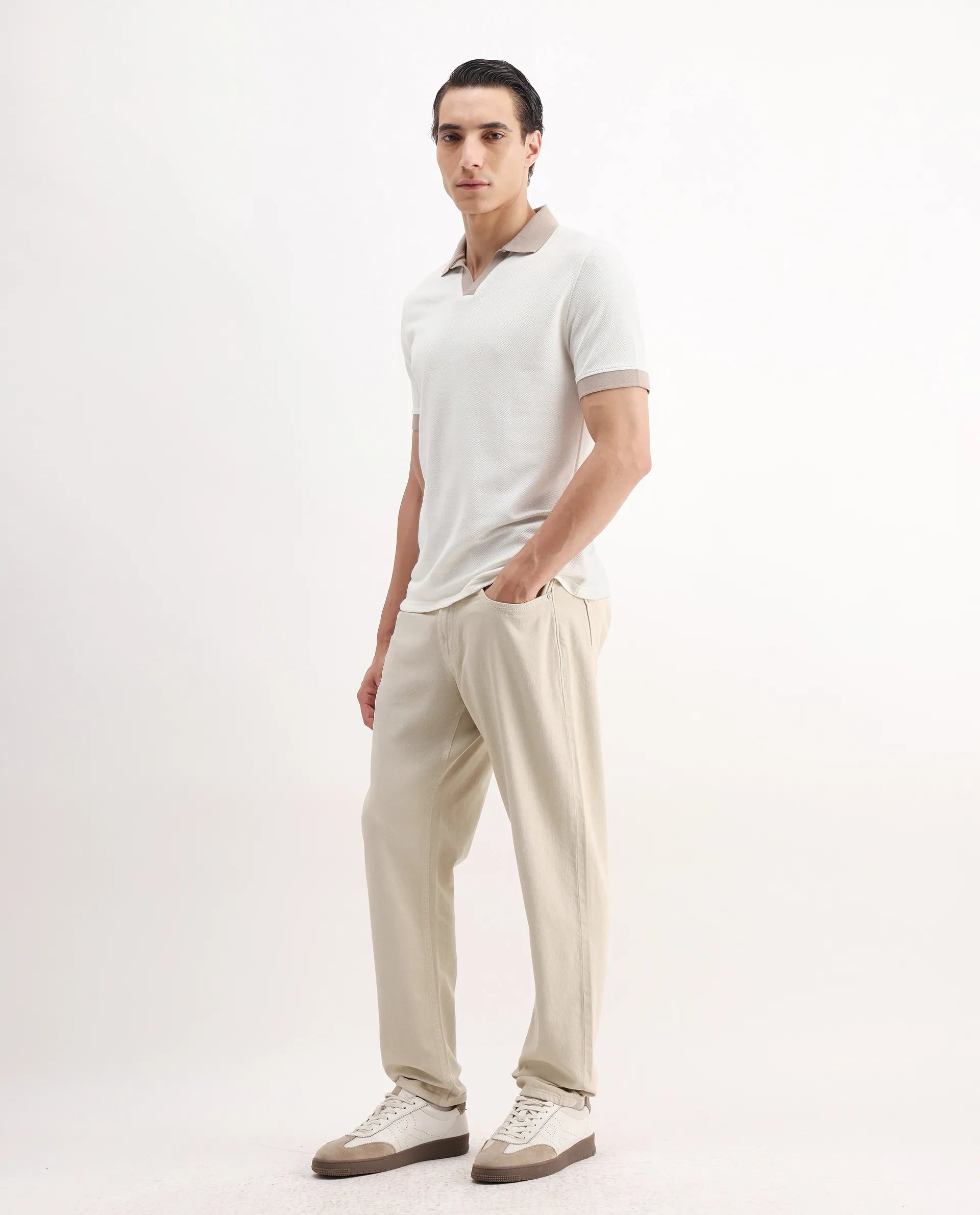 Rare Rabbit Men's Arvi-2 Light Beige Cotton Blend Plain Dond Carrot Fit Jeans